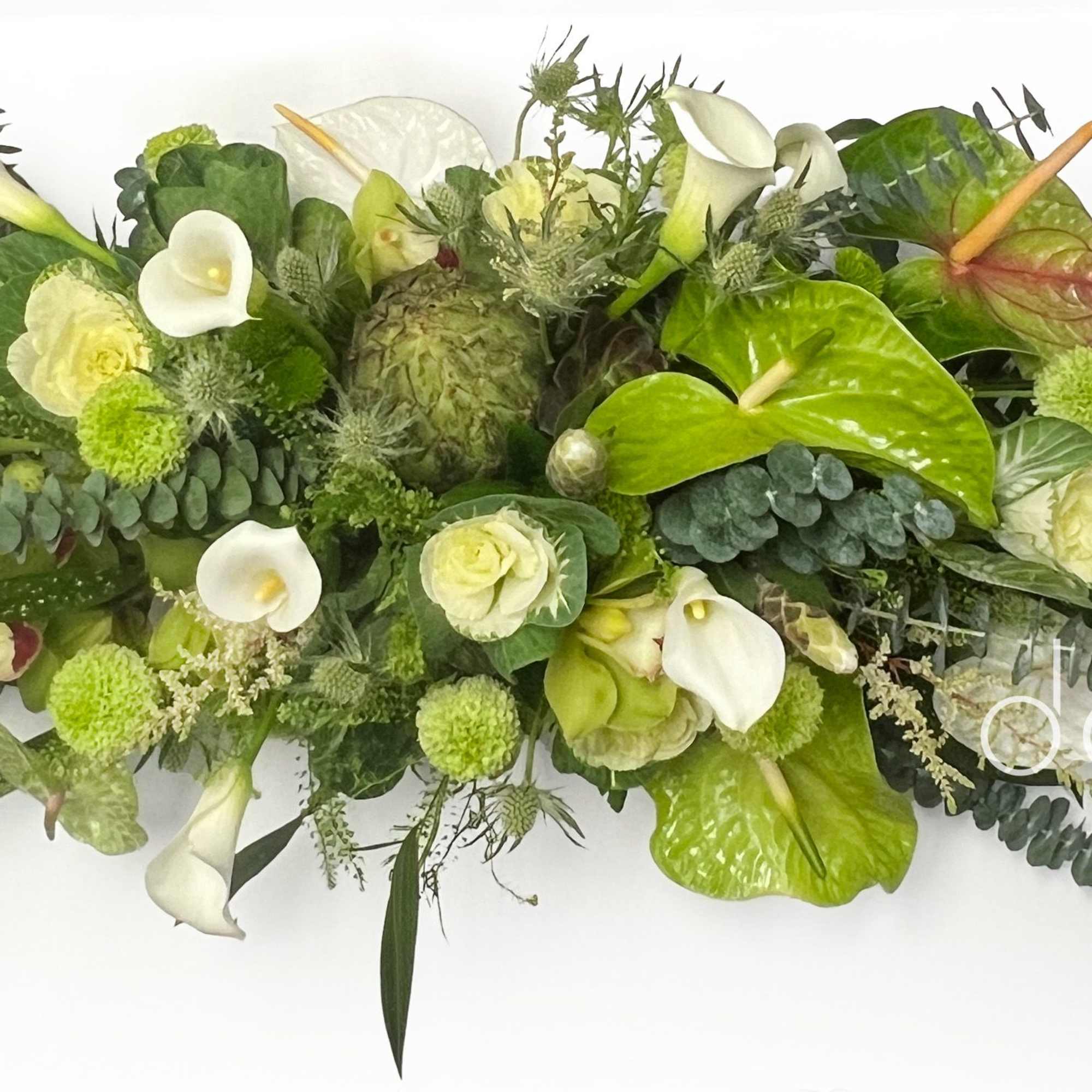 A long, low flower arrangement built in a rectangular wooden box, The