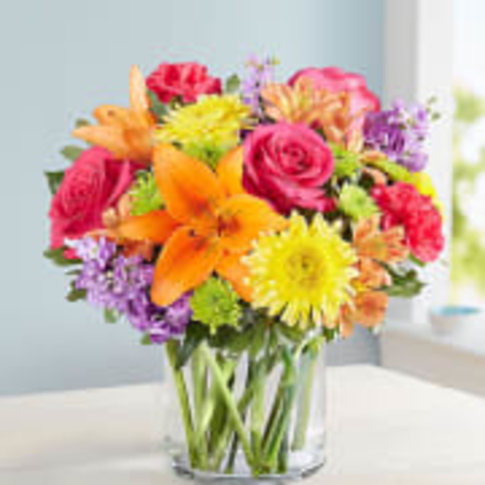 Colorful mixed bouquet in a clear glass vase