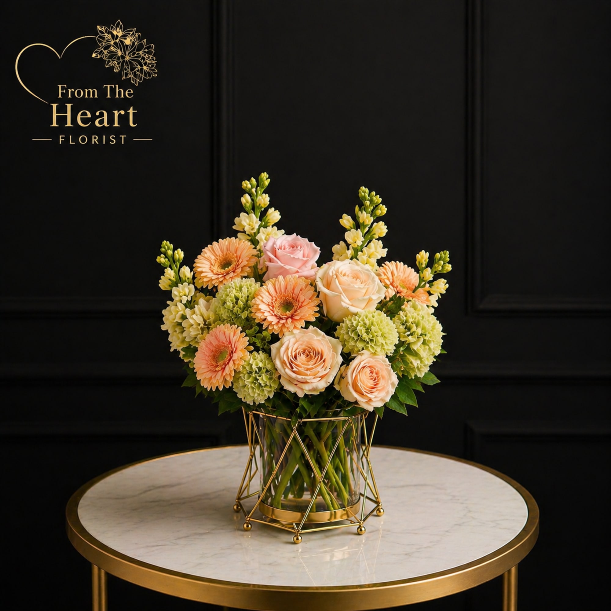 This elegant arrangement made with green hydrangea, pink and peach roses, cream