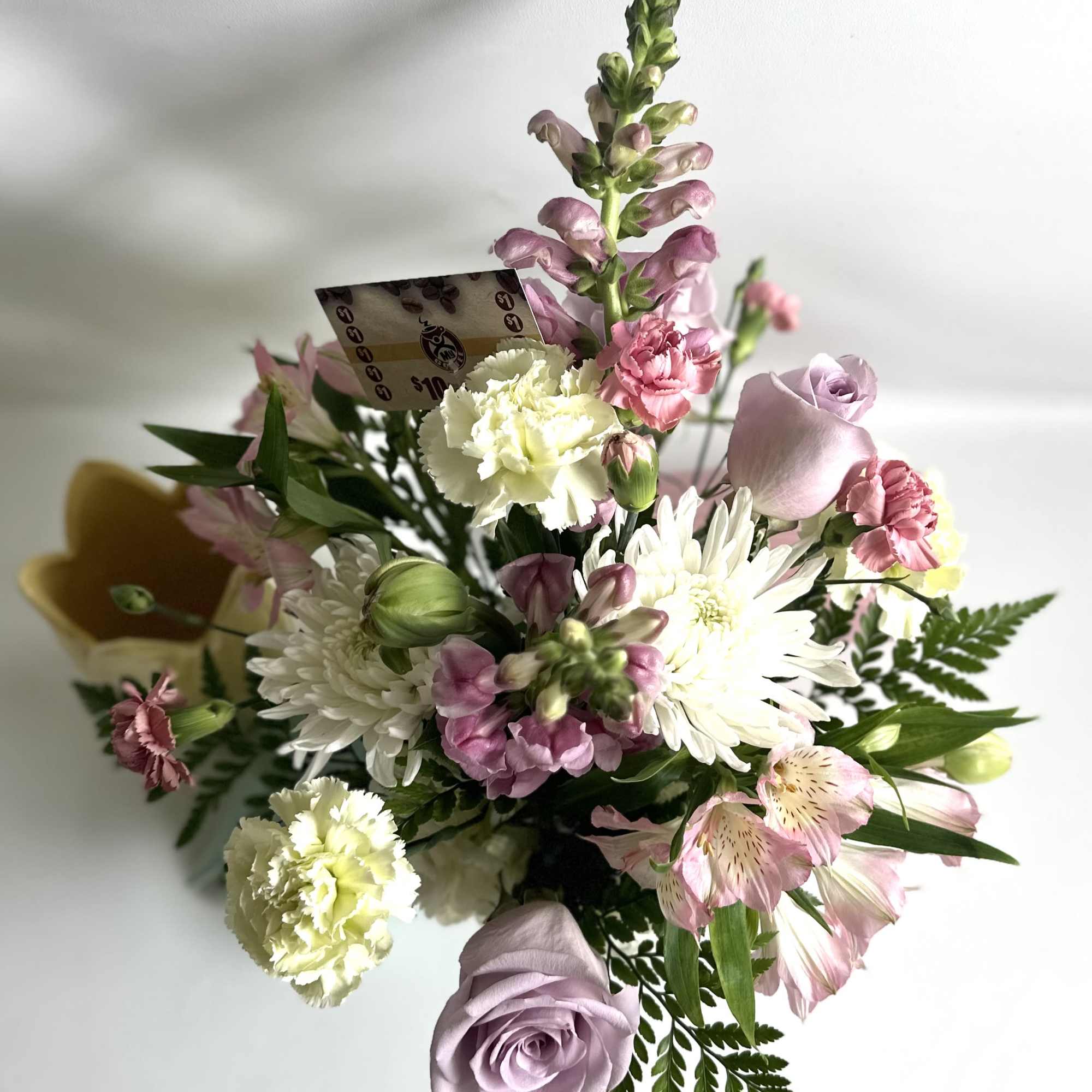 This beautiful ceramic Tulip vase is filled with roses, hydrangea, tulips, carnations