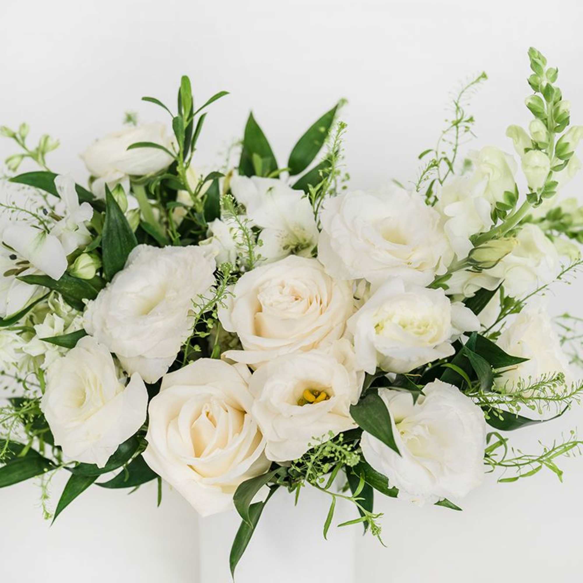 Our Petite Seasonal Arrangement features pretty neutral seasonal blooms, making it the