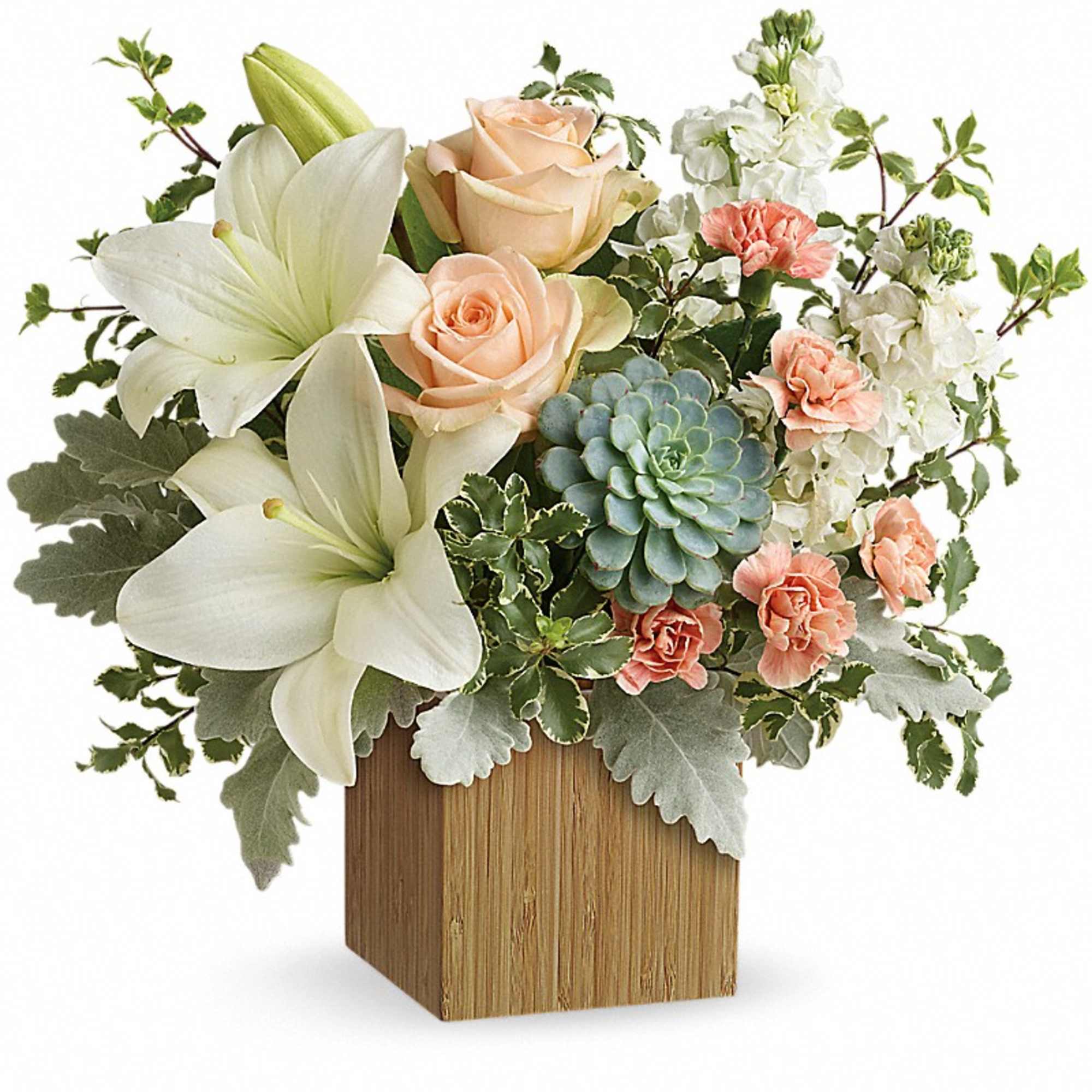 Bouquet of white lilies, peach roses, and carnations in a wooden cube vase