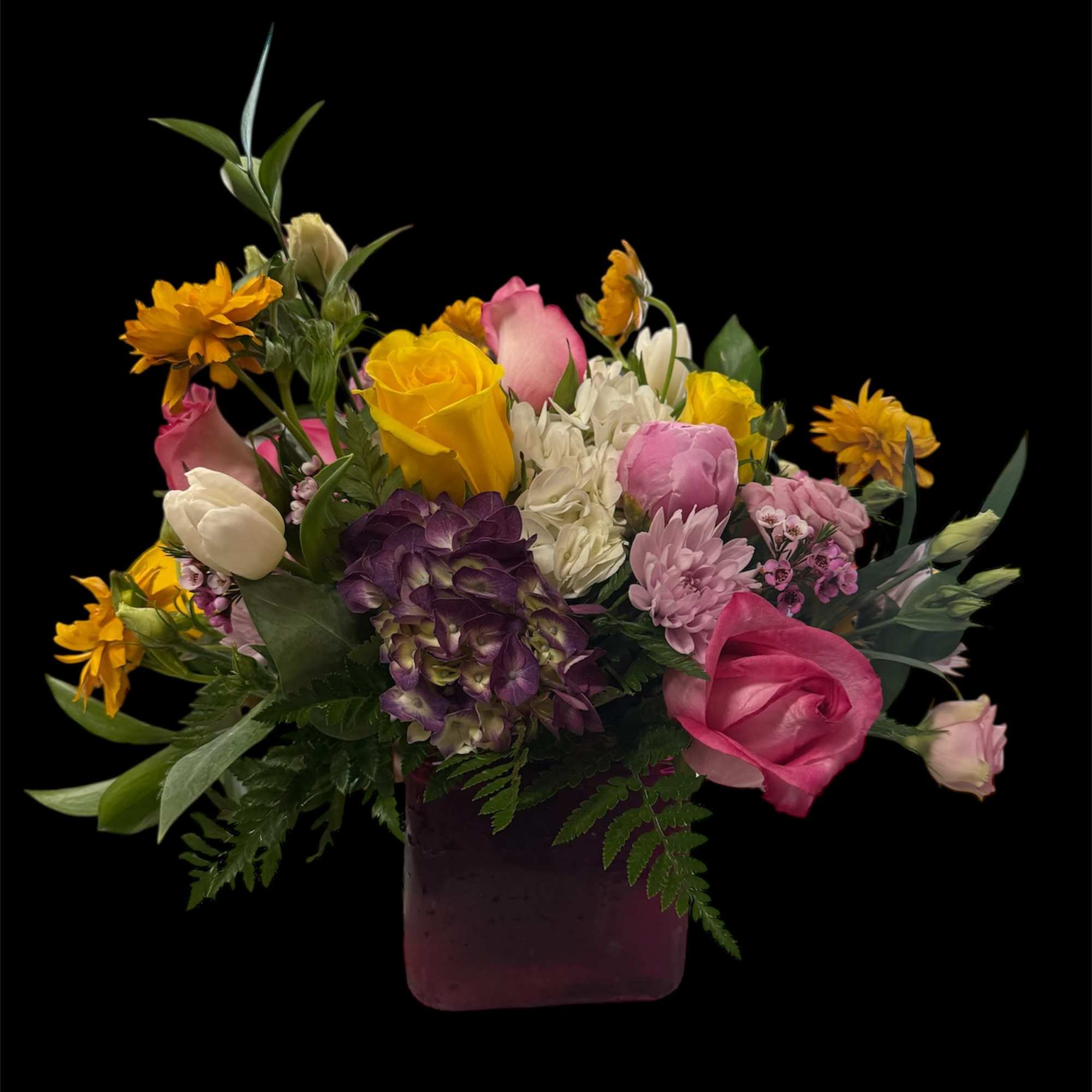 An artfully arranged selection of fresh blooms.

Due to disruptions in the global