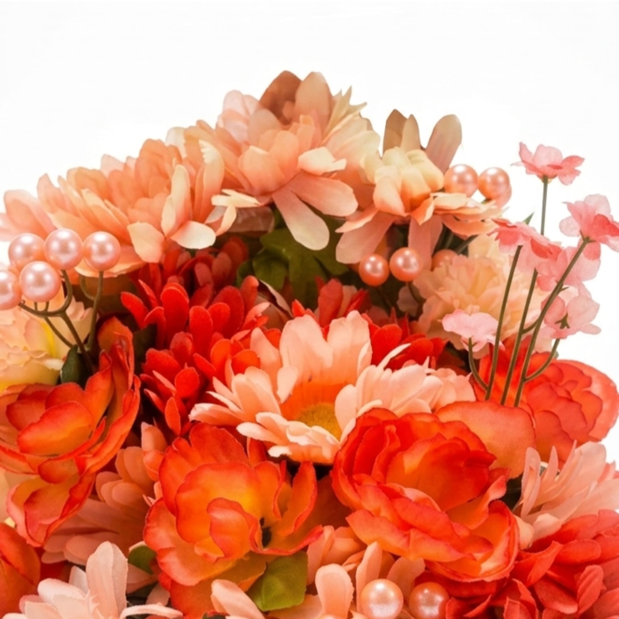 A bright, cheerful silk bouquet arranged low in a gift box, perfect