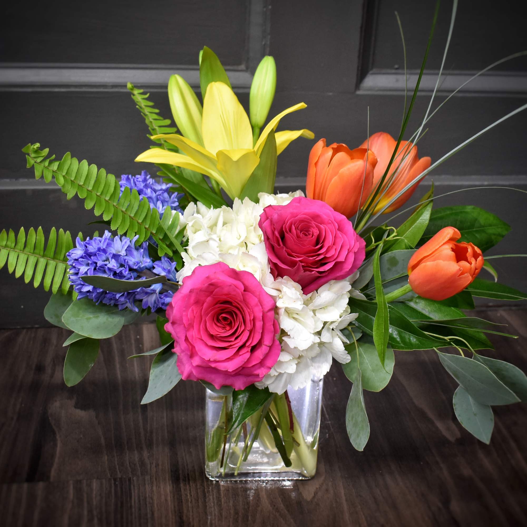 Bright, garden-fresh color greets the recipient with a lively mix of pink