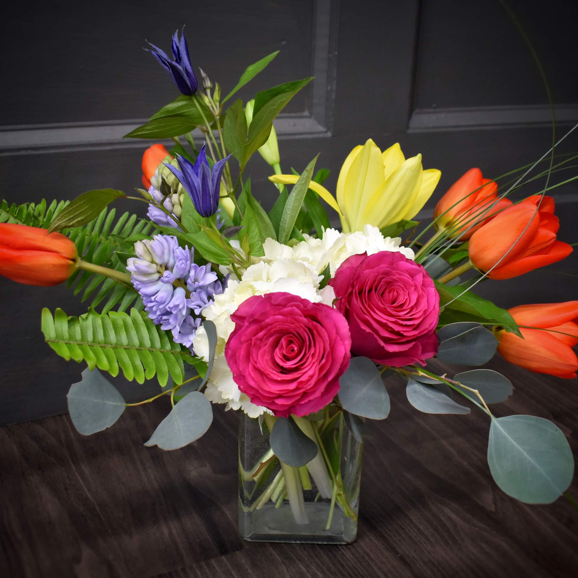 Bright, garden-fresh color greets the recipient with a lively mix of pink