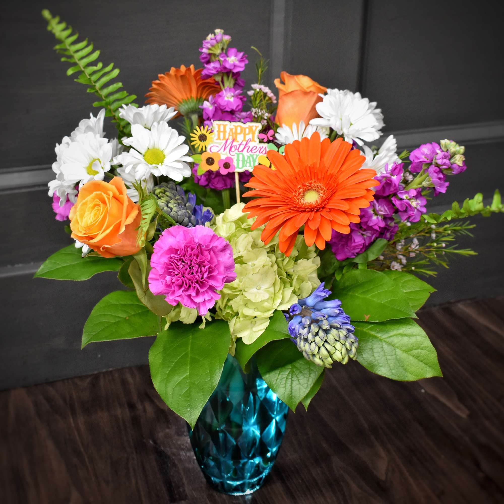 A bright burst of spring-Sunshine and Smiles is a mixed flower arrangement