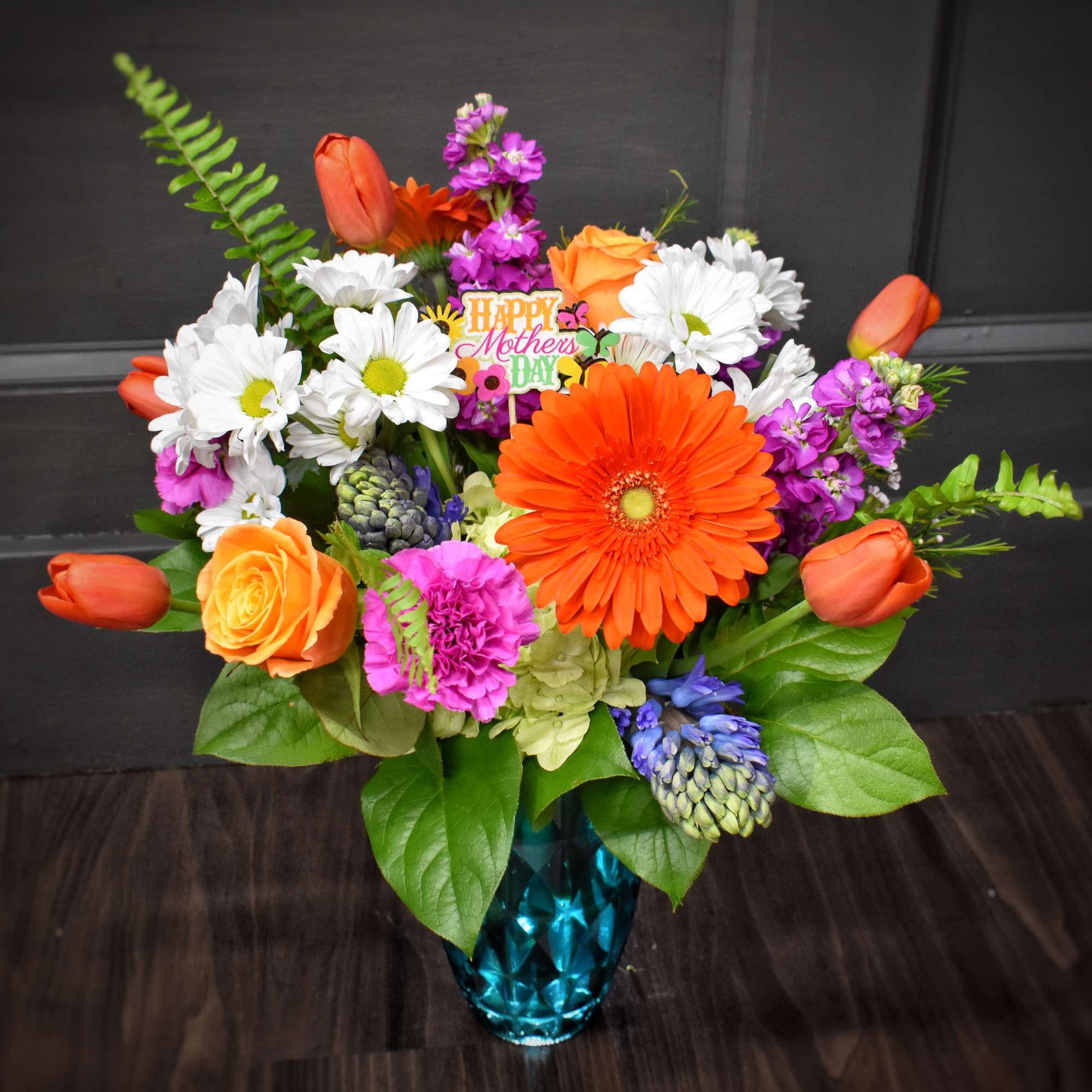 A bright burst of spring-Sunshine and Smiles is a mixed flower arrangement