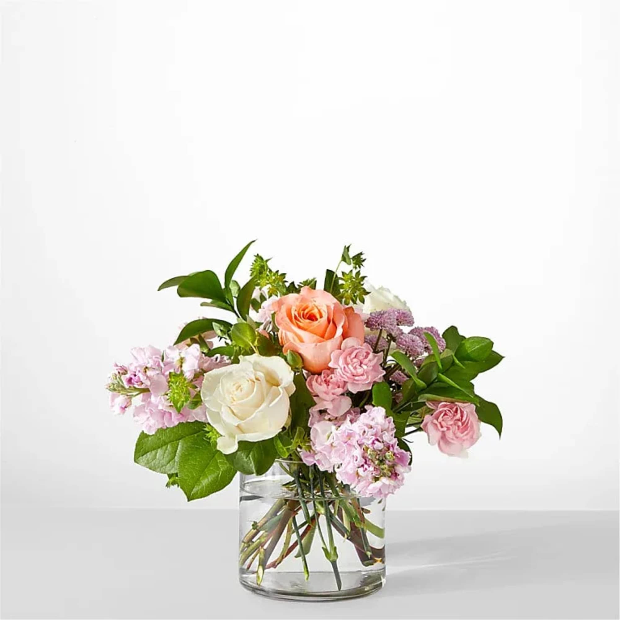 Serene and fragrant, this arrangement blends soft pastels to create a gift