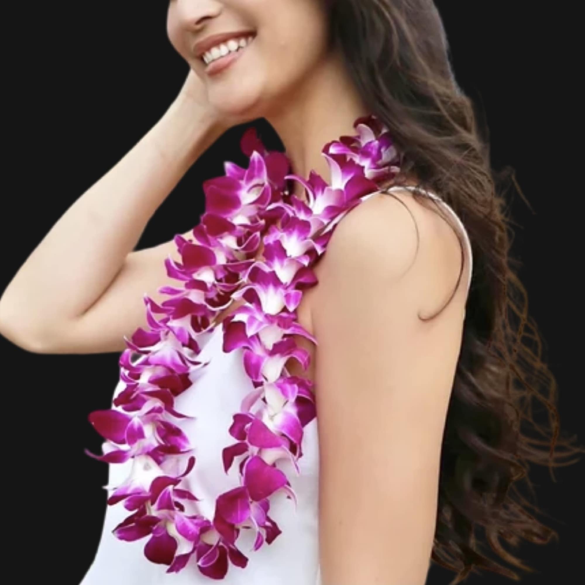 Woman wearing a purple orchid lei over a white dress