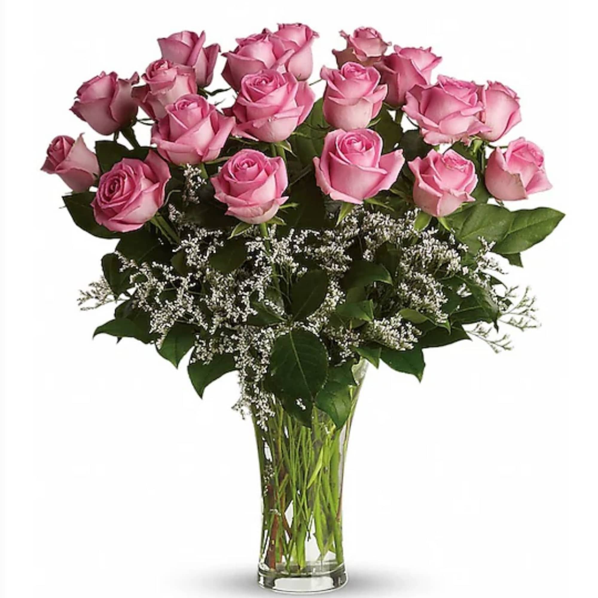 Tall clear vase of pink roses with white filler flowers