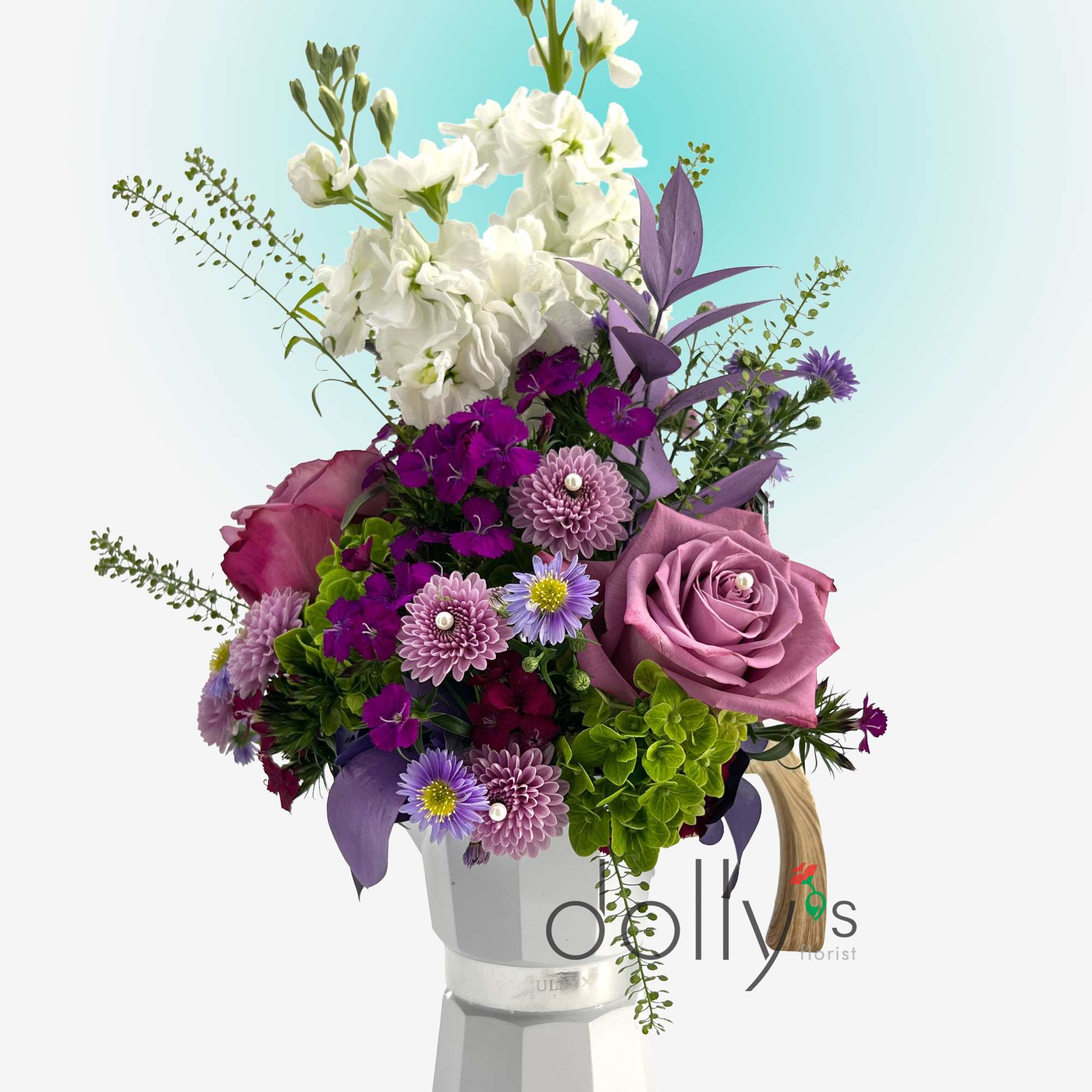 Purple and white mixed bouquet in a white vase