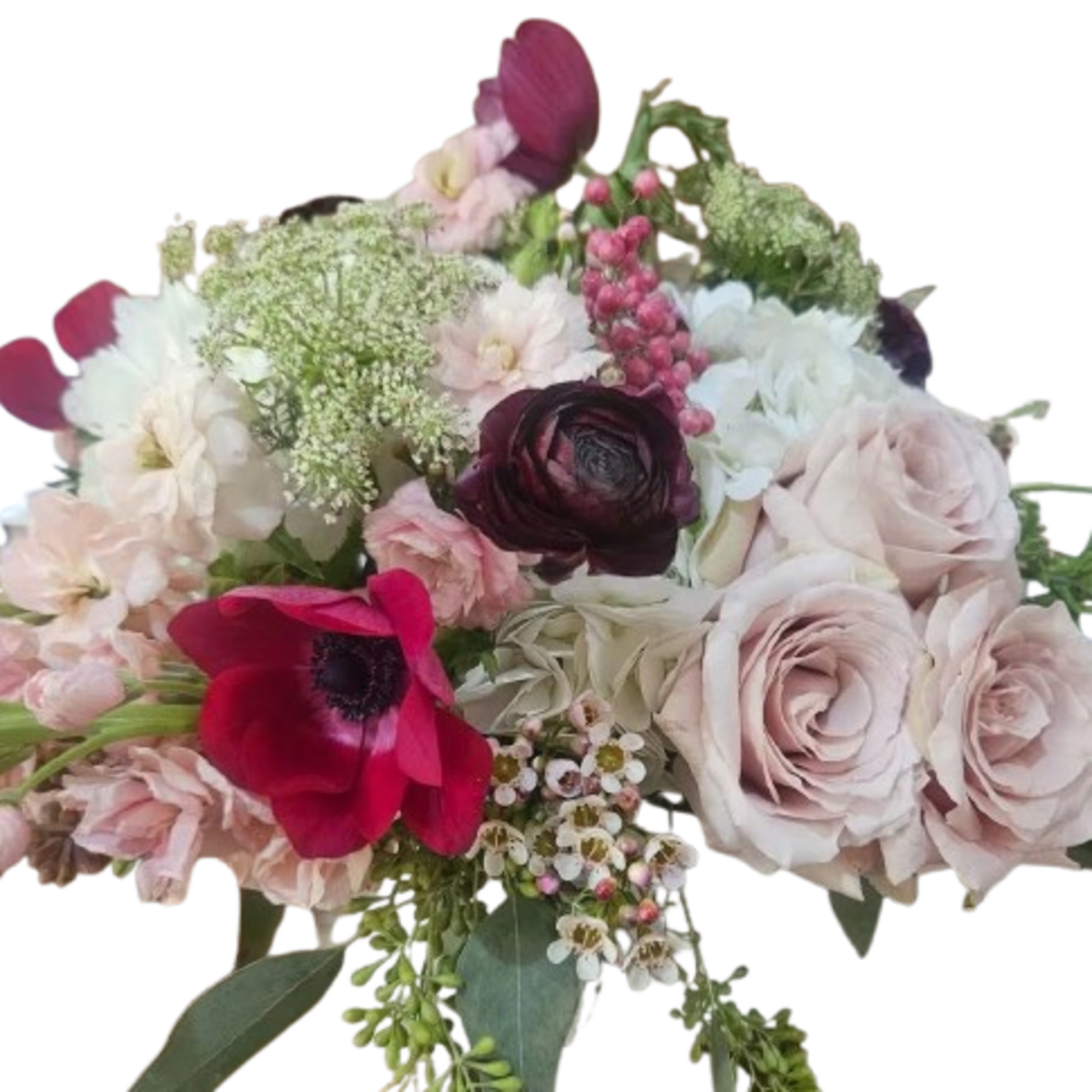 Roses, cymbidium orchids, hydrangea, pink stock, ranunculus, tulips, wax flower, berries, seeded