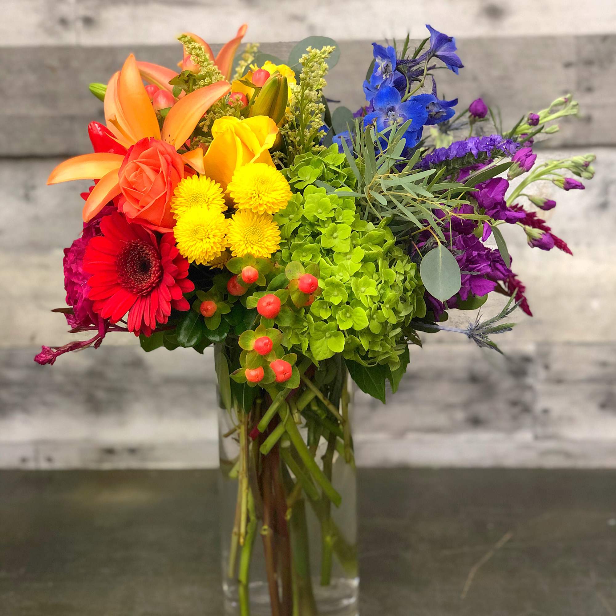Colorful mixed bouquet in a clear glass vase