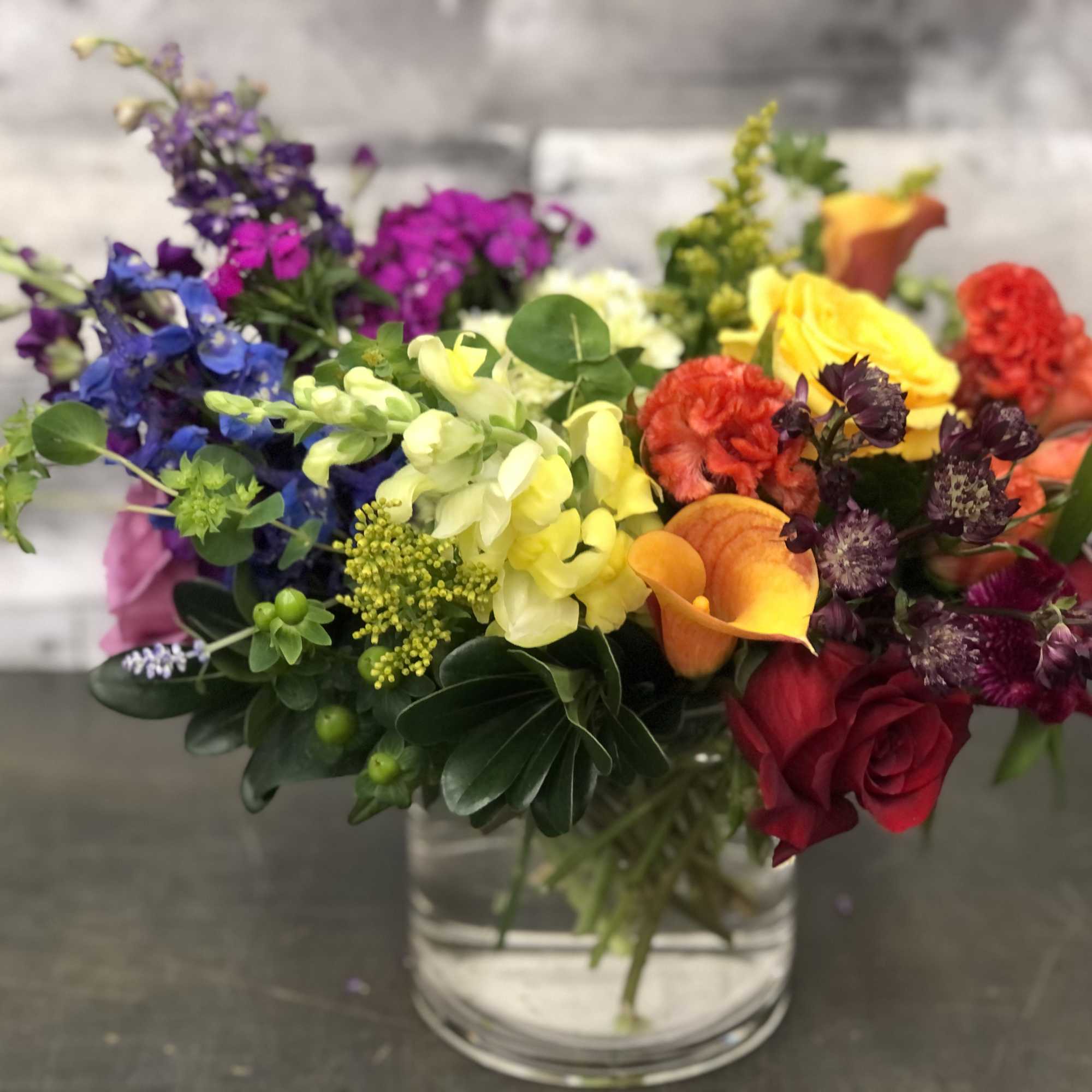 Colorful mixed bouquet in a clear glass vase
