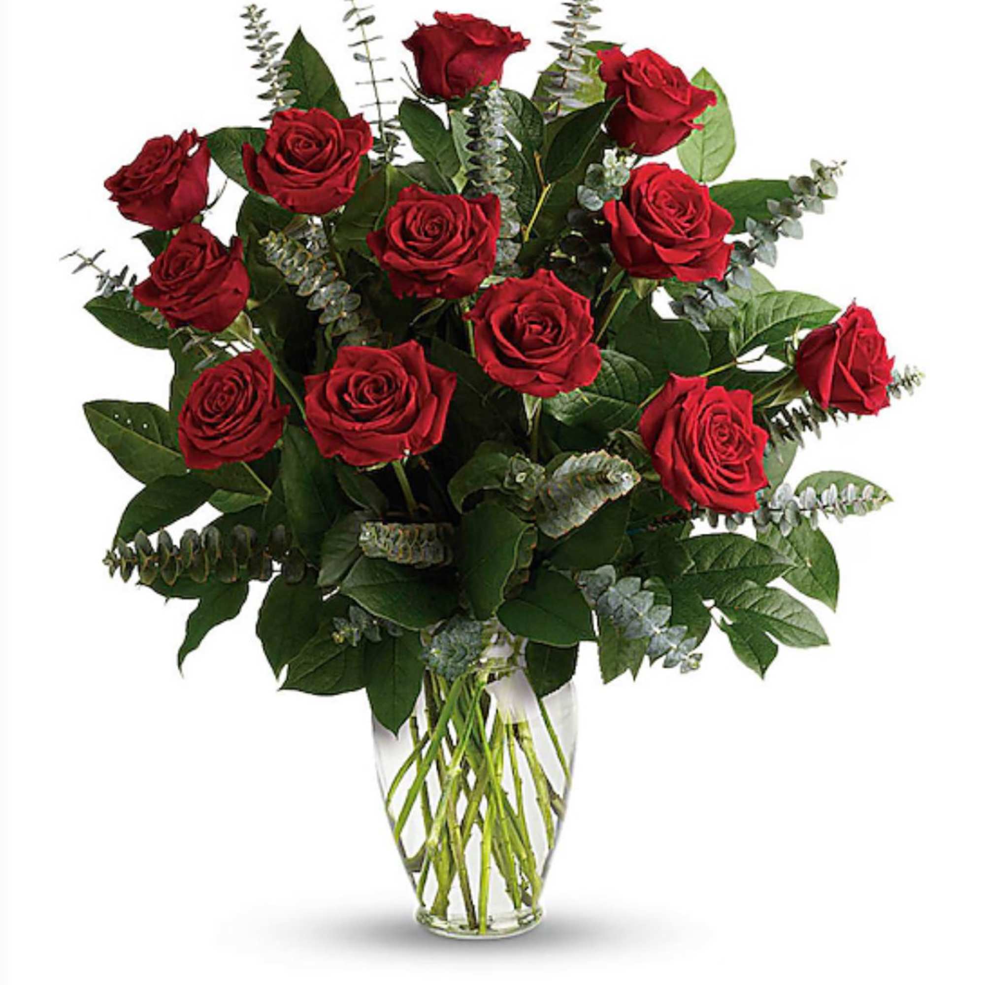 Red roses arranged in a clear glass vase