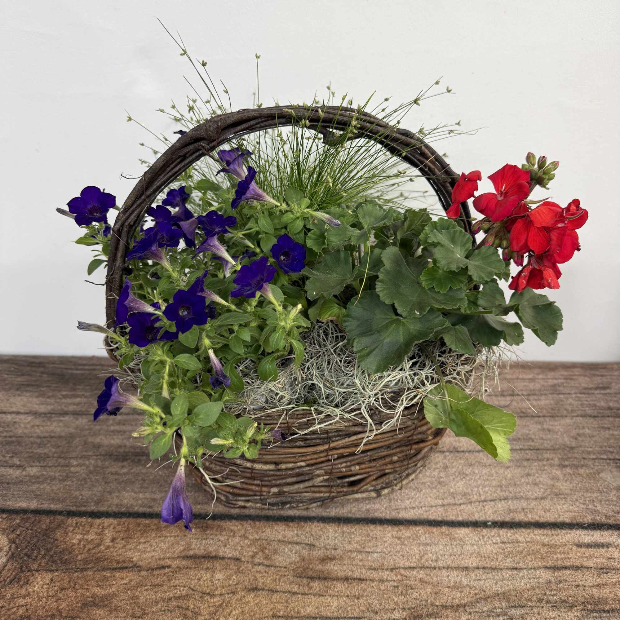 Grapevine basket containing a mix of annual plants that can also be