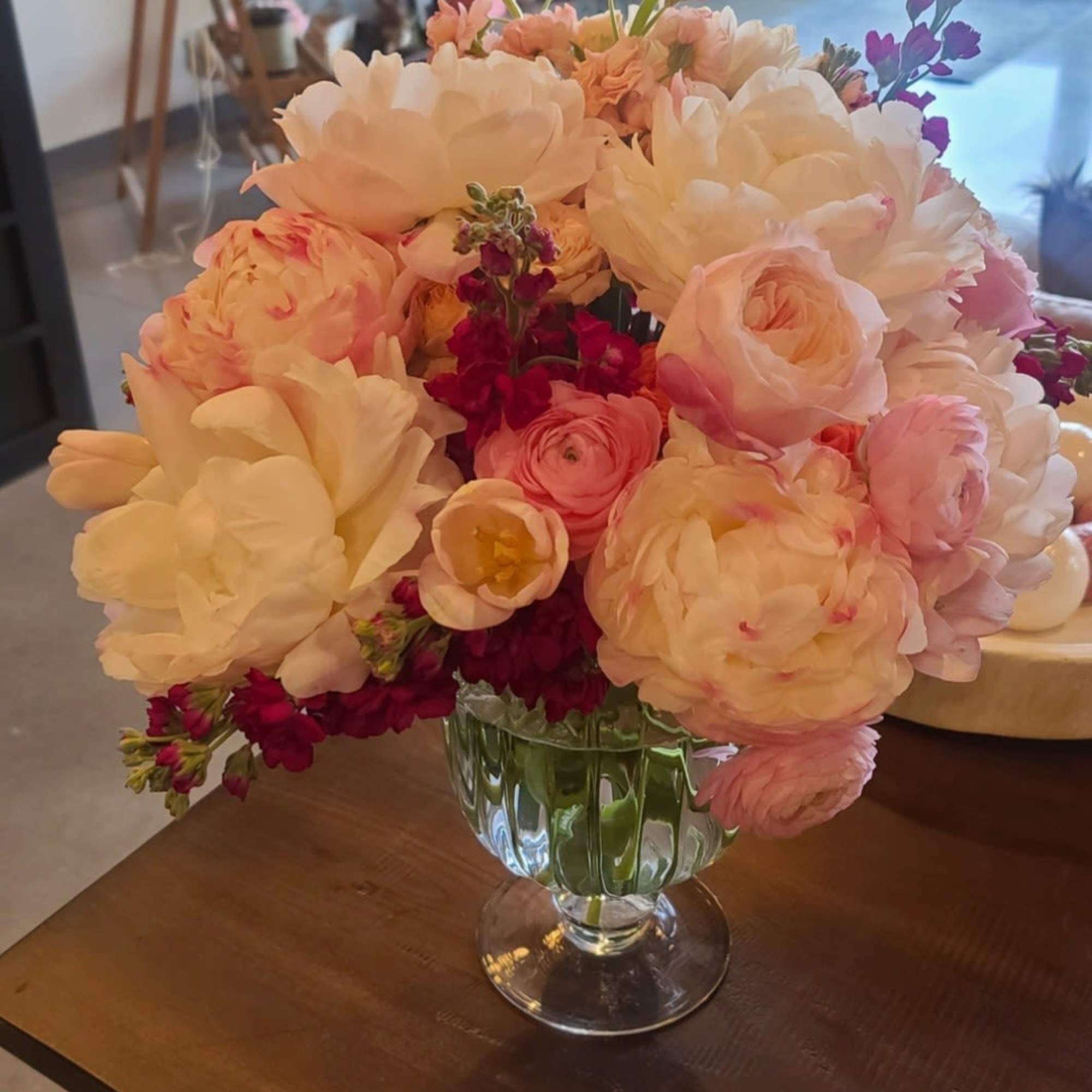 A swoon-worthy swirl of pillowy peonies, ranunculus, and buttery blooms in shades