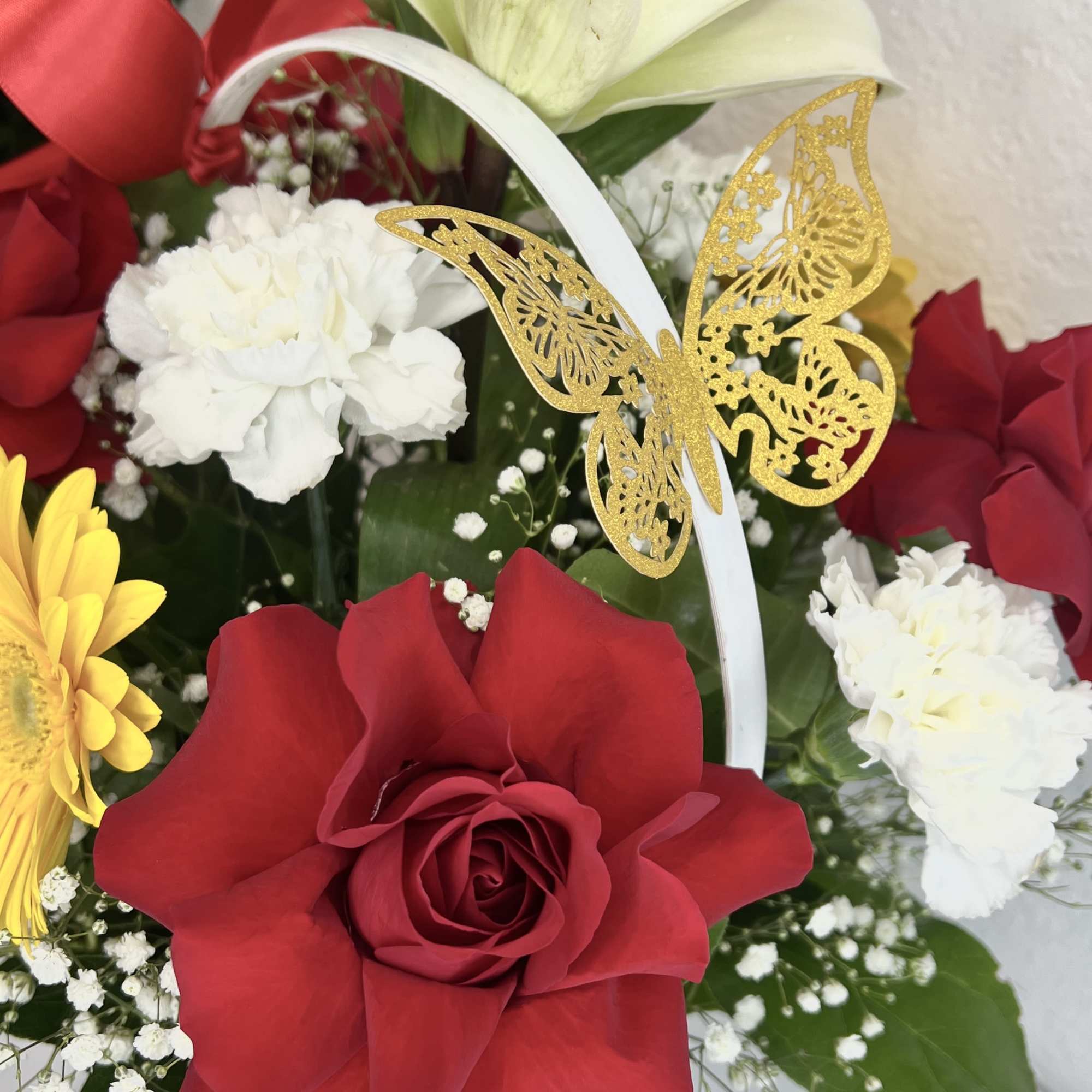 Bouquet with red roses, white lilies, and white carnations
