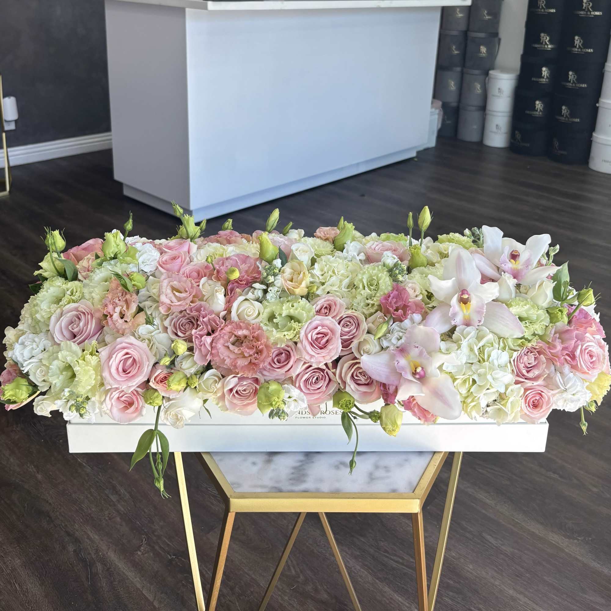 Large pastel floral arrangement in a white rectangular box
