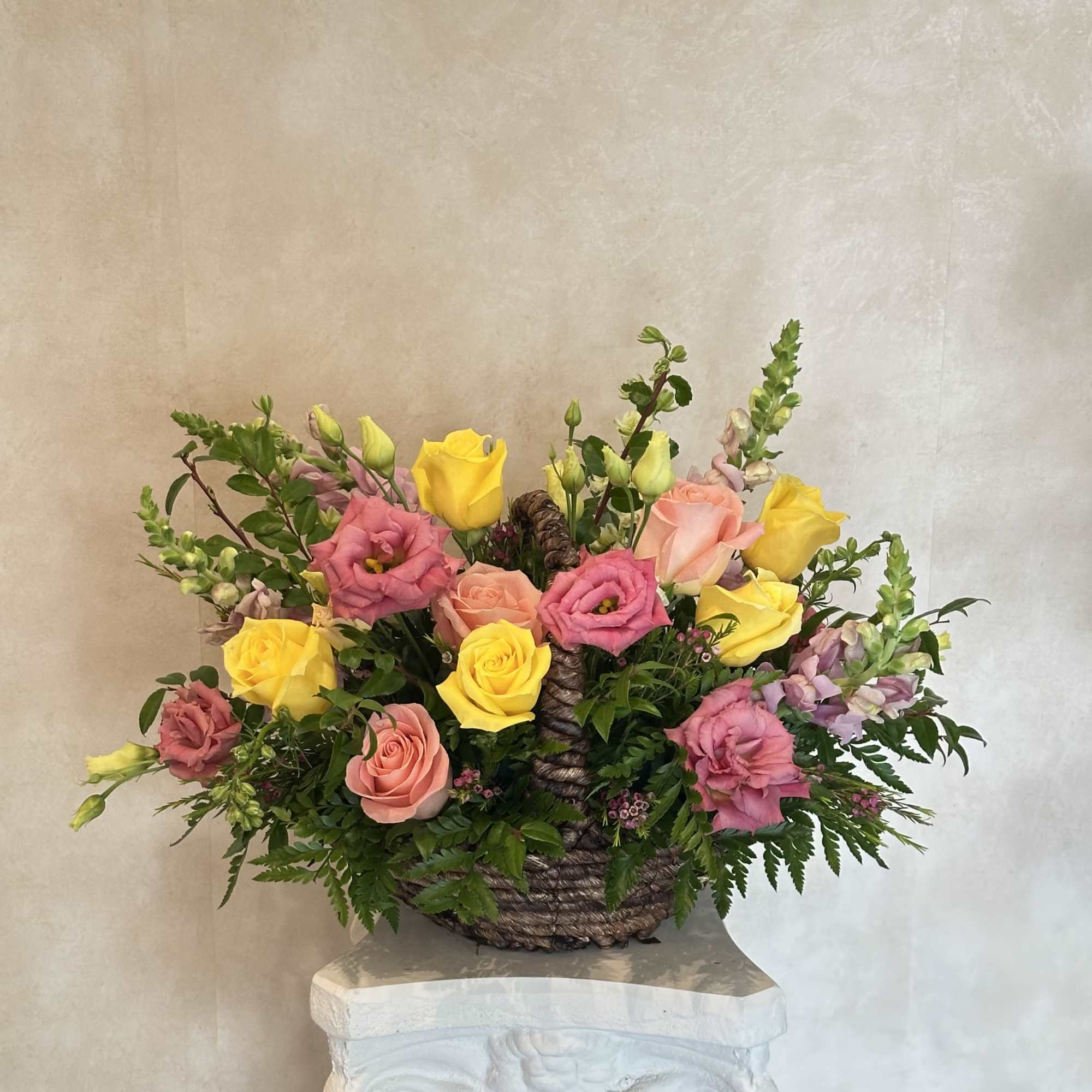 Beautiful basket with Lisianthus, pink and yellow roses, snapdragon and wax&hellip;