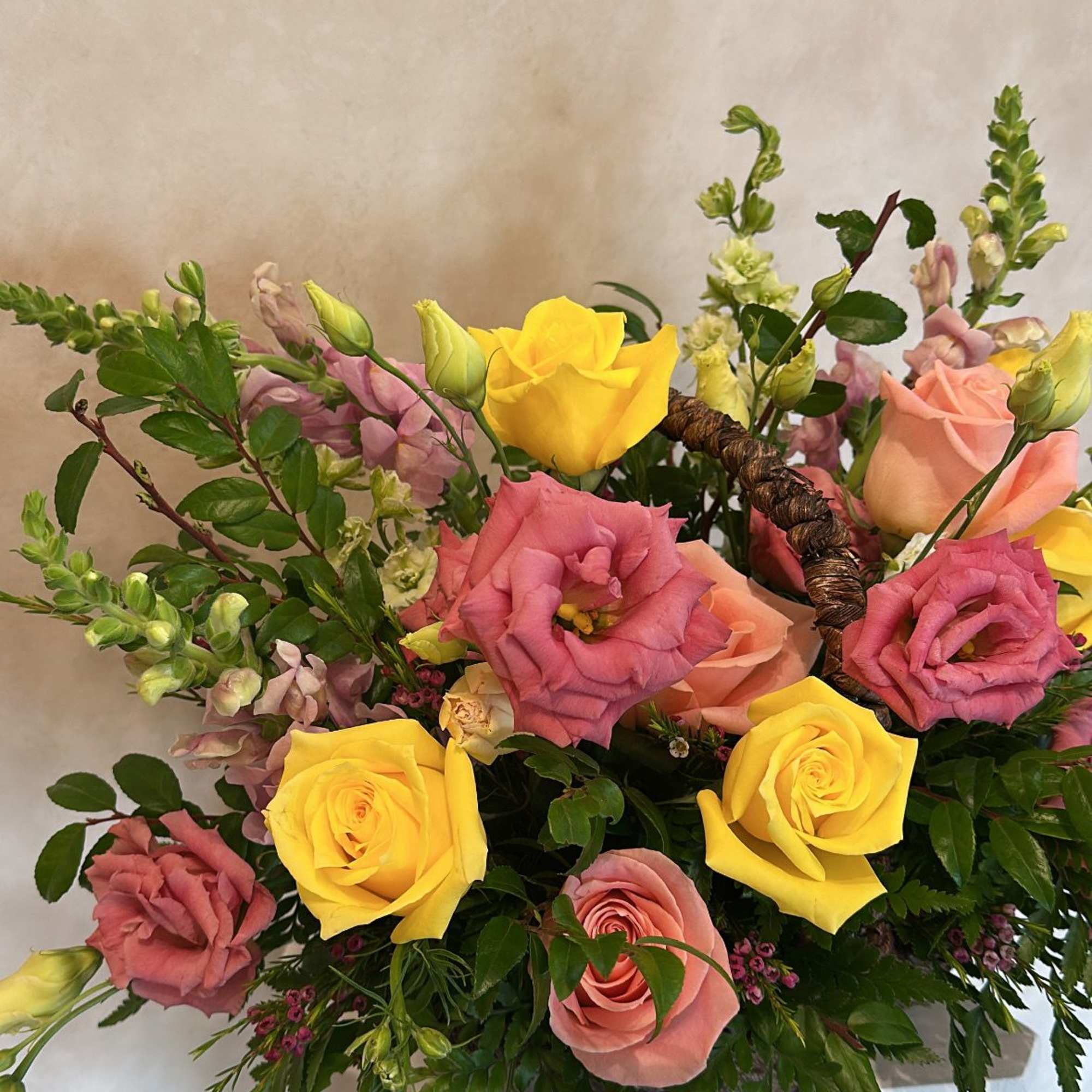 Beautiful basket with Lisianthus, pink and yellow roses, snapdragon and wax&hellip;
