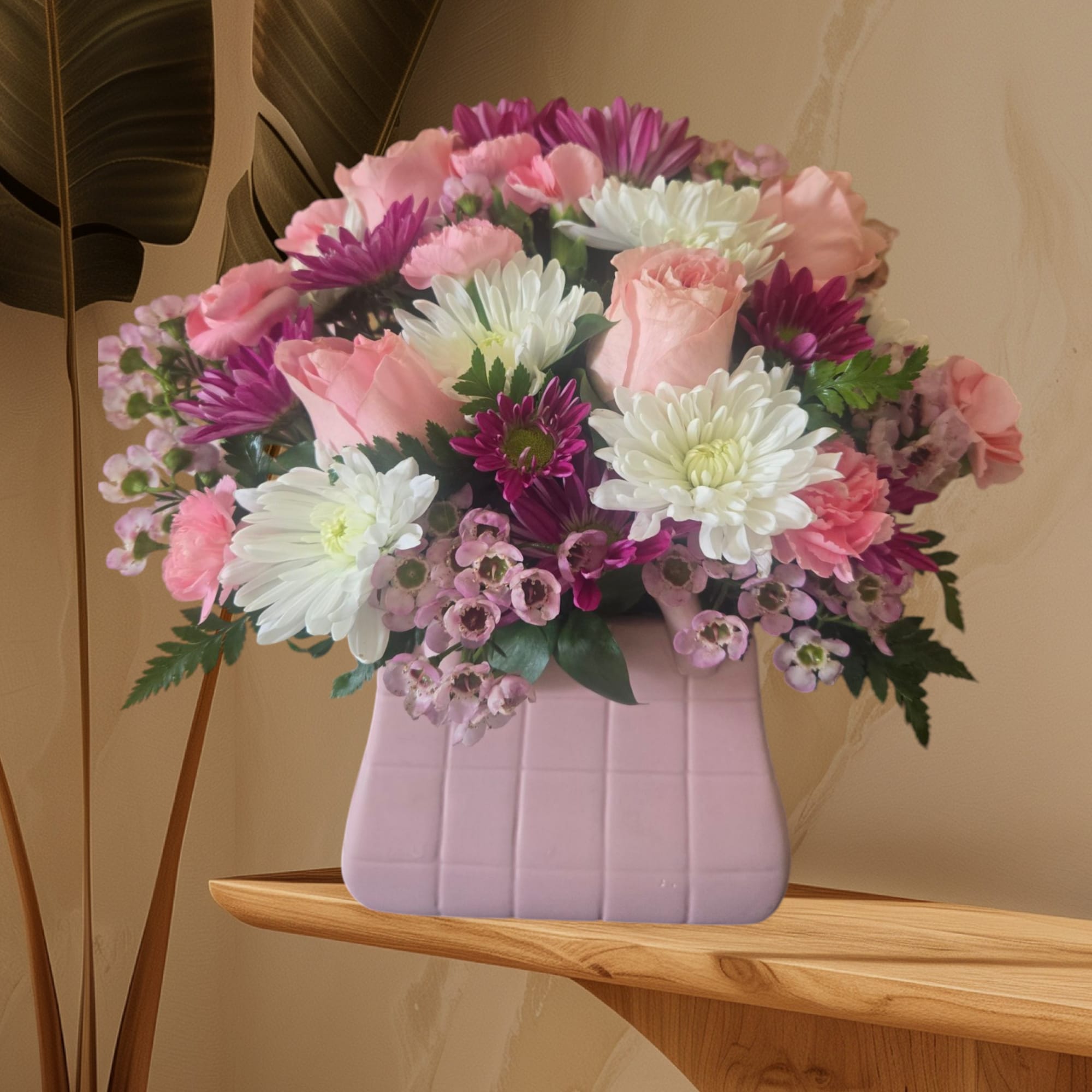 Pink and white mixed bouquet in a lavender vase
