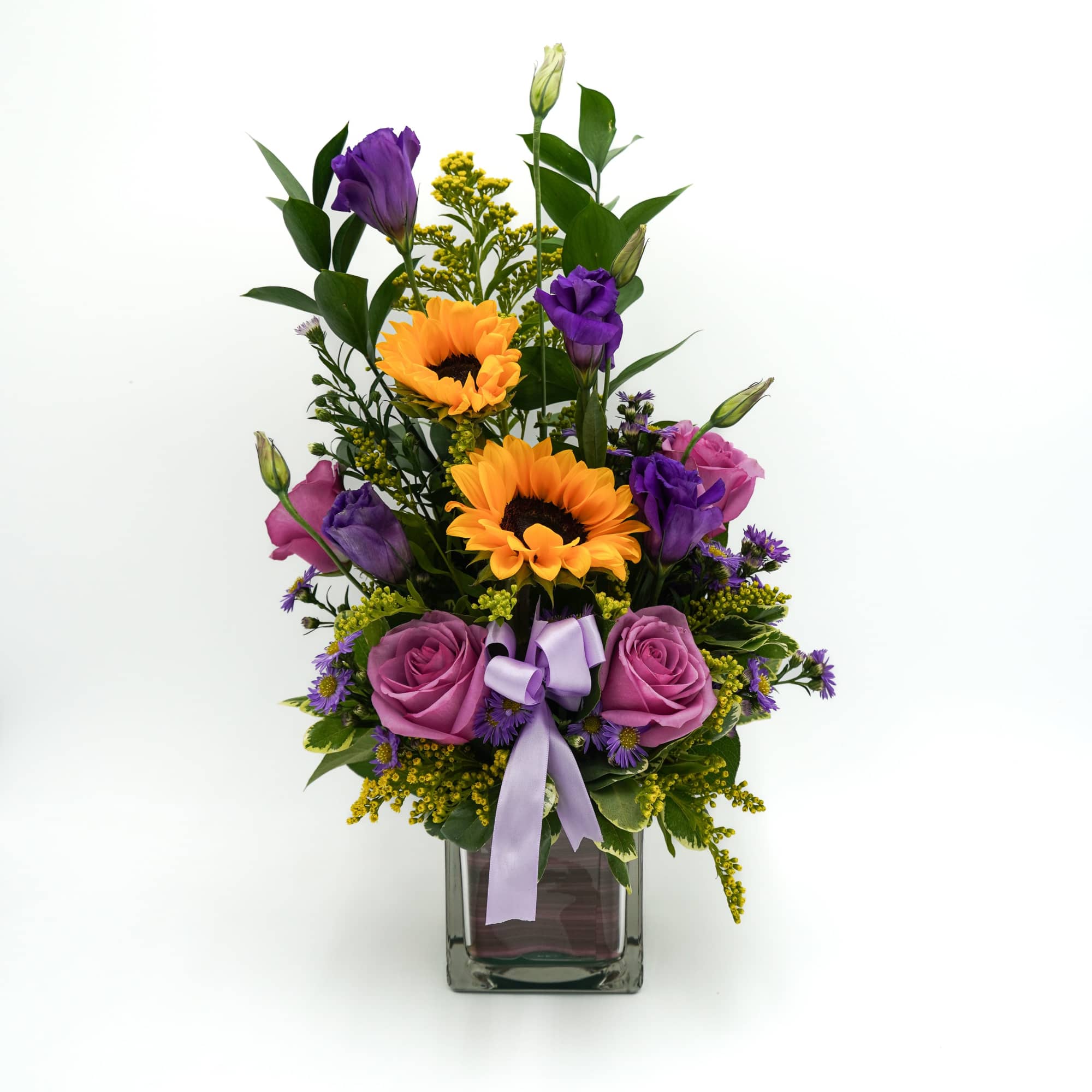 A beautiful mix of lavender roses and bright sunflowers, arranged in a