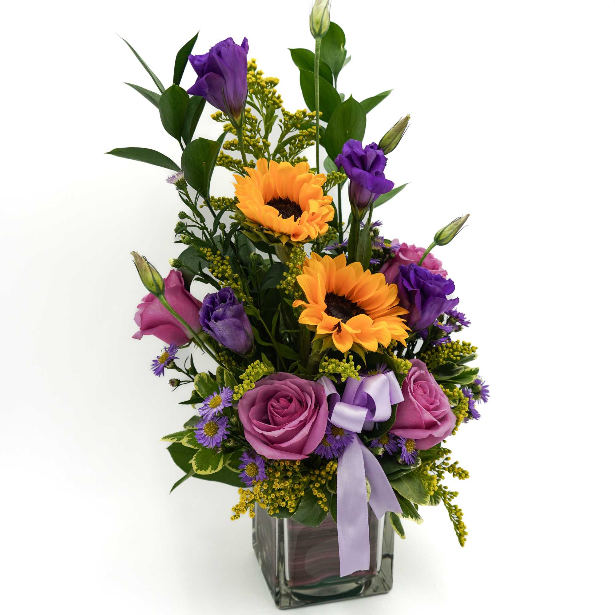 A beautiful mix of lavender roses and bright sunflowers, arranged in a