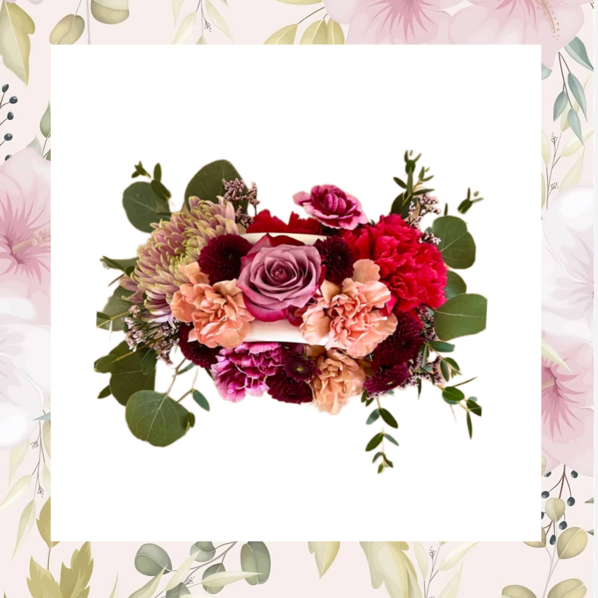 Mixed pink and burgundy floral arrangement with eucalyptus accents