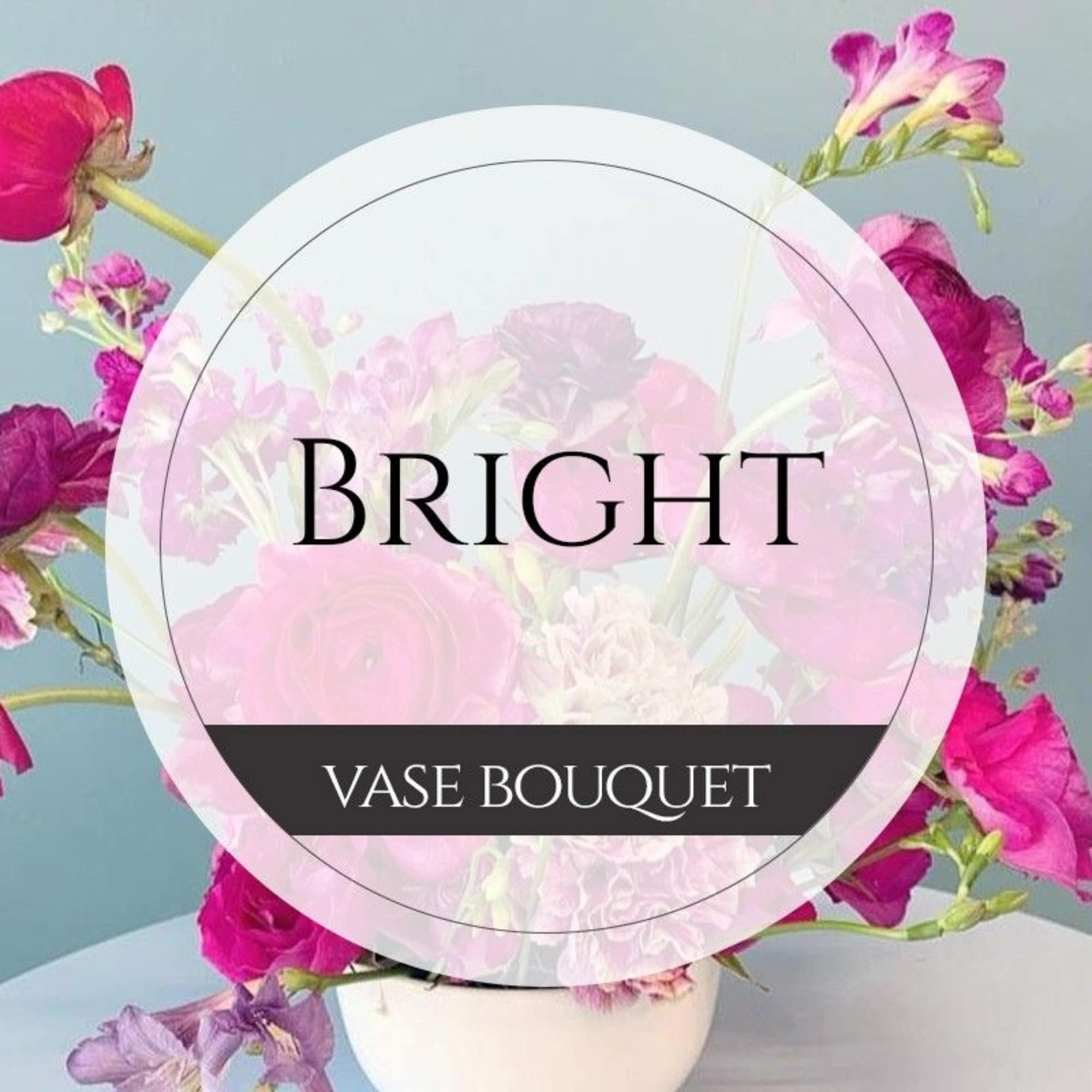 Pink and purple bouquet in a white vase with a bright label overlay