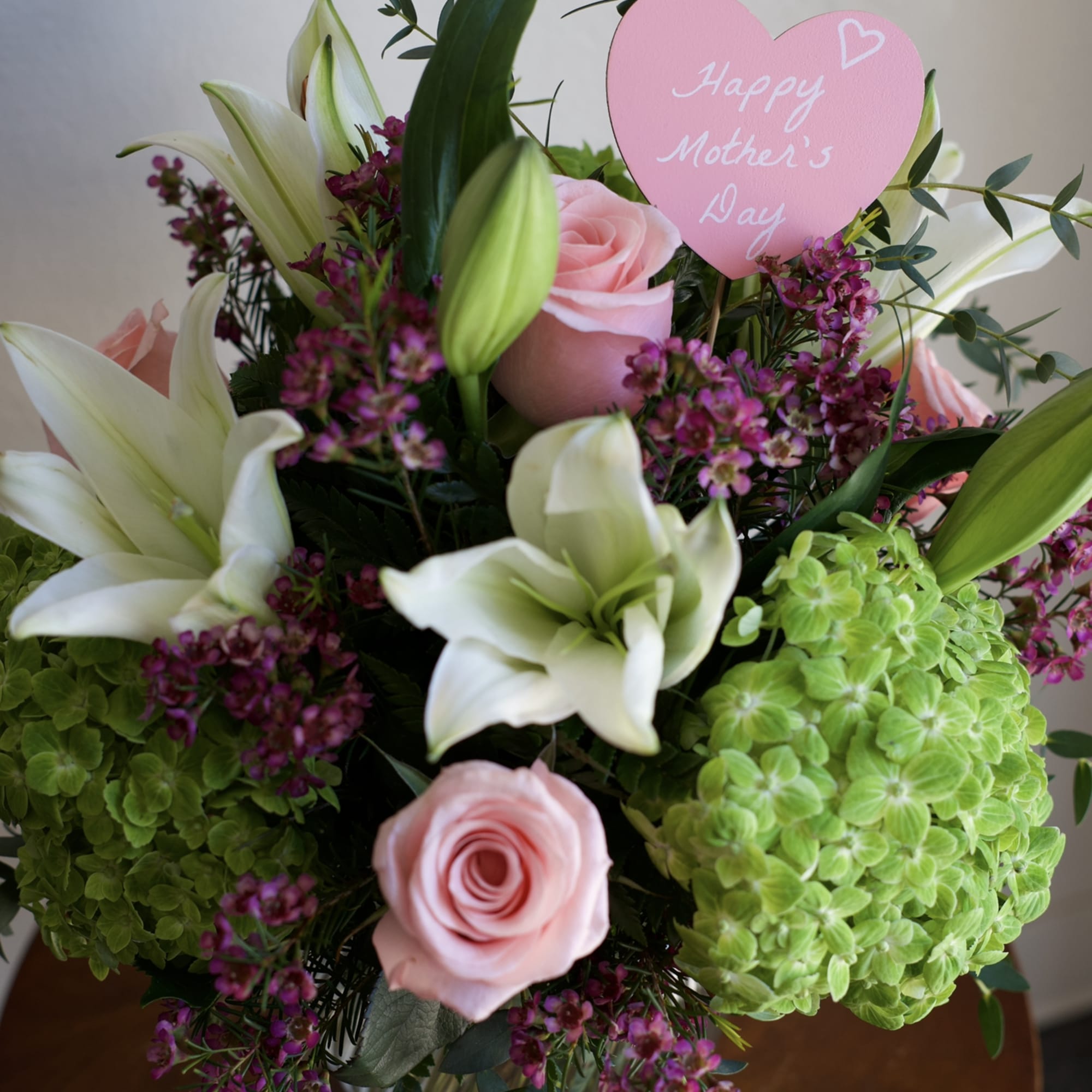 A fresh and elegant Mother&rsquo;s Day arrangement featuring lush green hydrangeas, classic