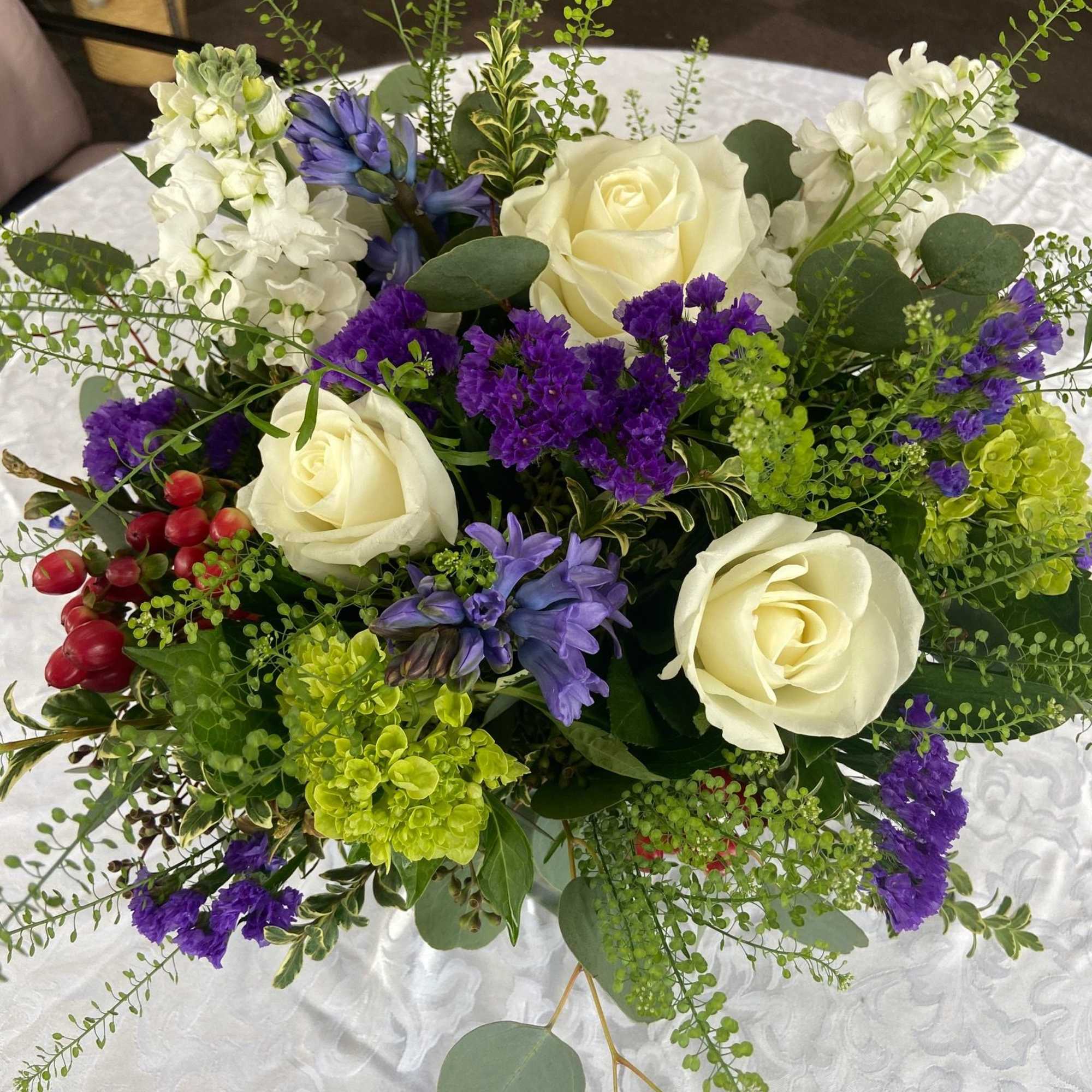 Sweet Sincerity is a beautiful mix of roses, hyacinths, stock, hydrangea, and