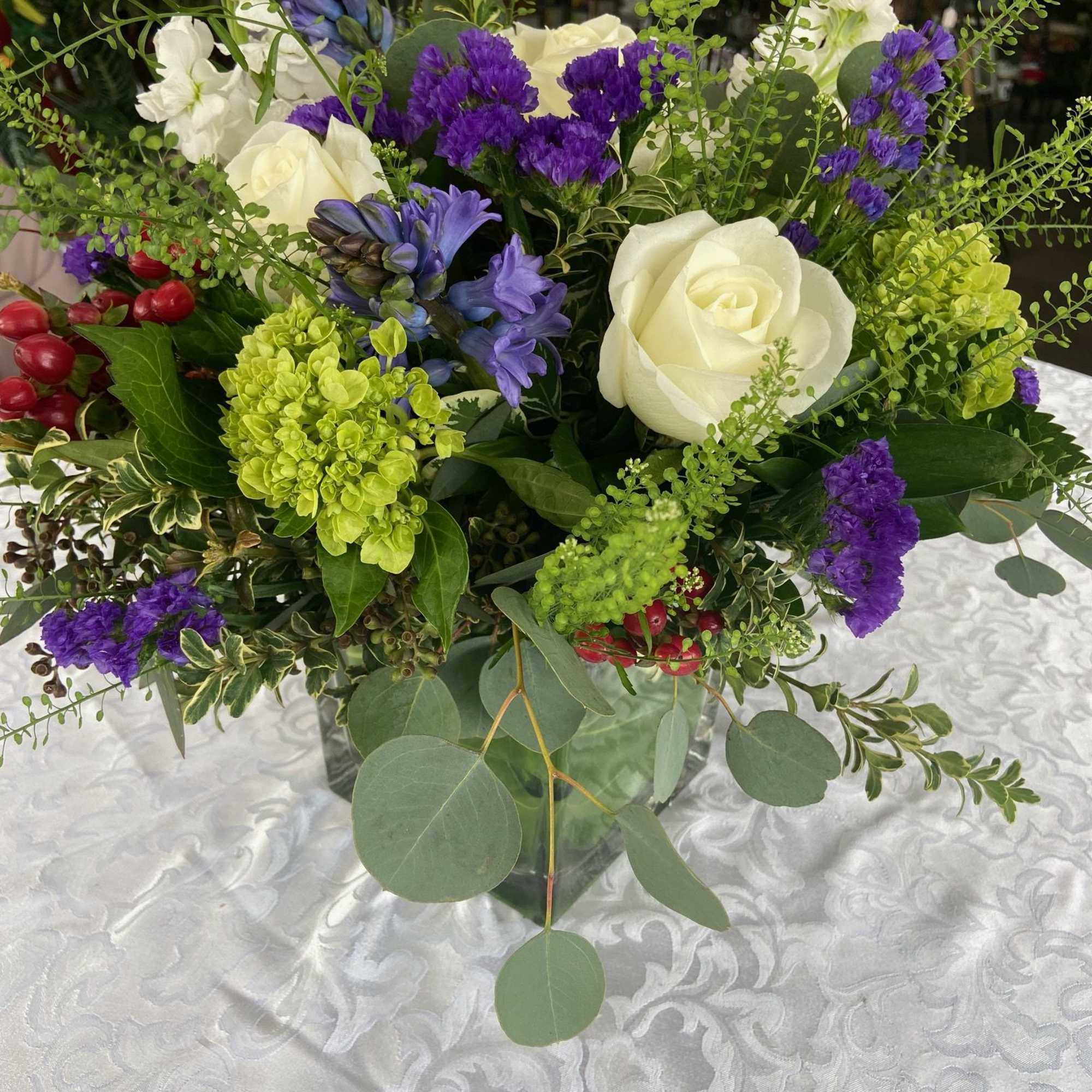 Sweet Sincerity is a beautiful mix of roses, hyacinths, stock, hydrangea, and