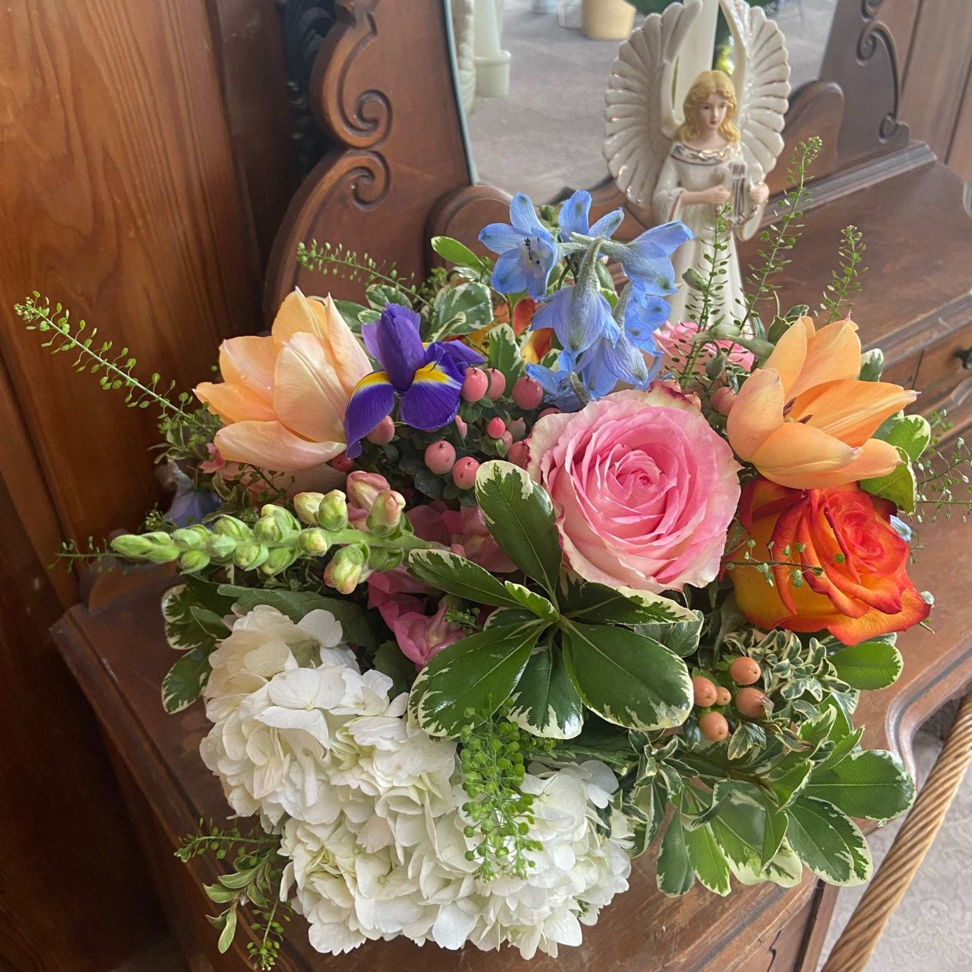 Mix of bright but feminine Spring flowers in 5 x 5 cylinder.