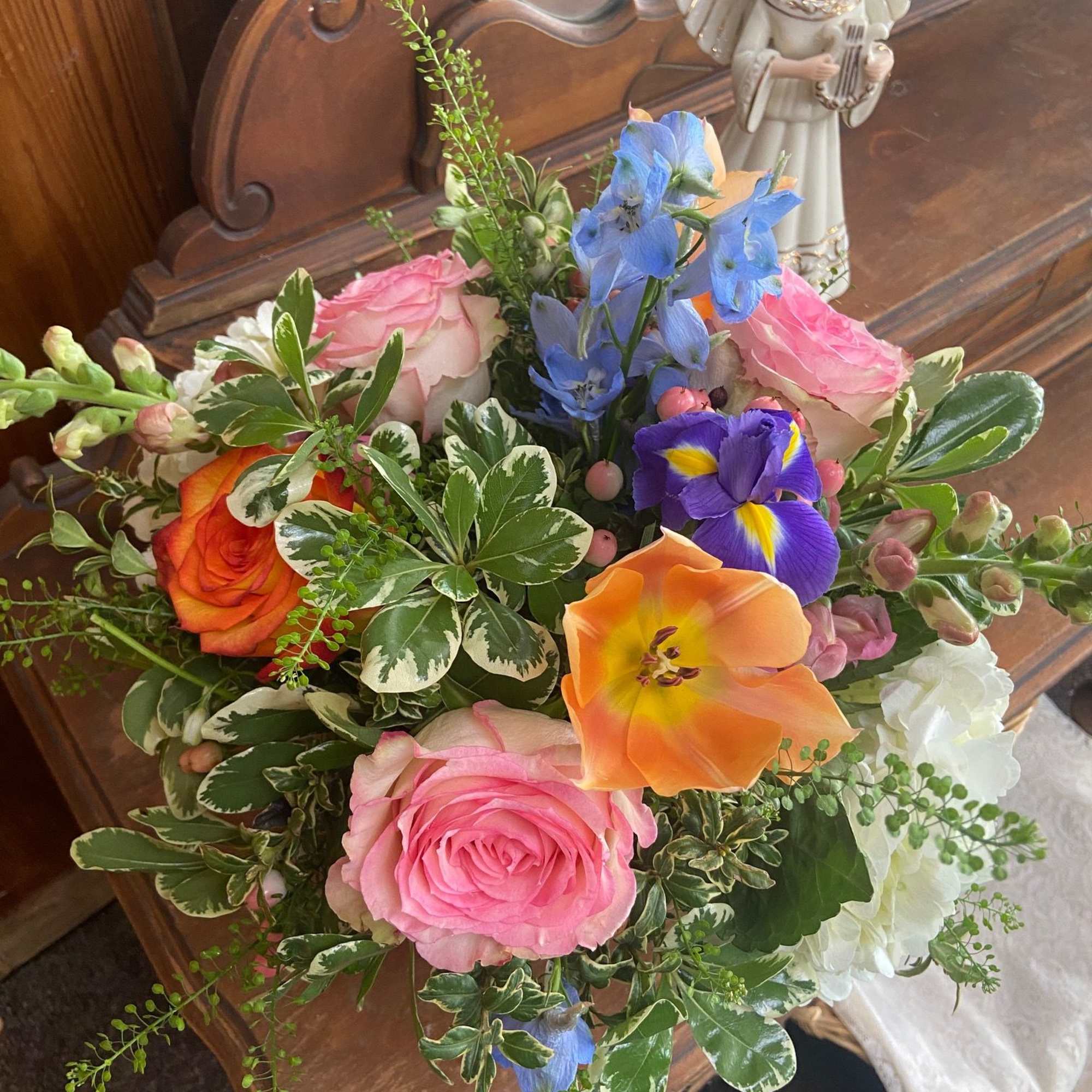 Mix of bright but feminine Spring flowers in 5 x 5 cylinder.