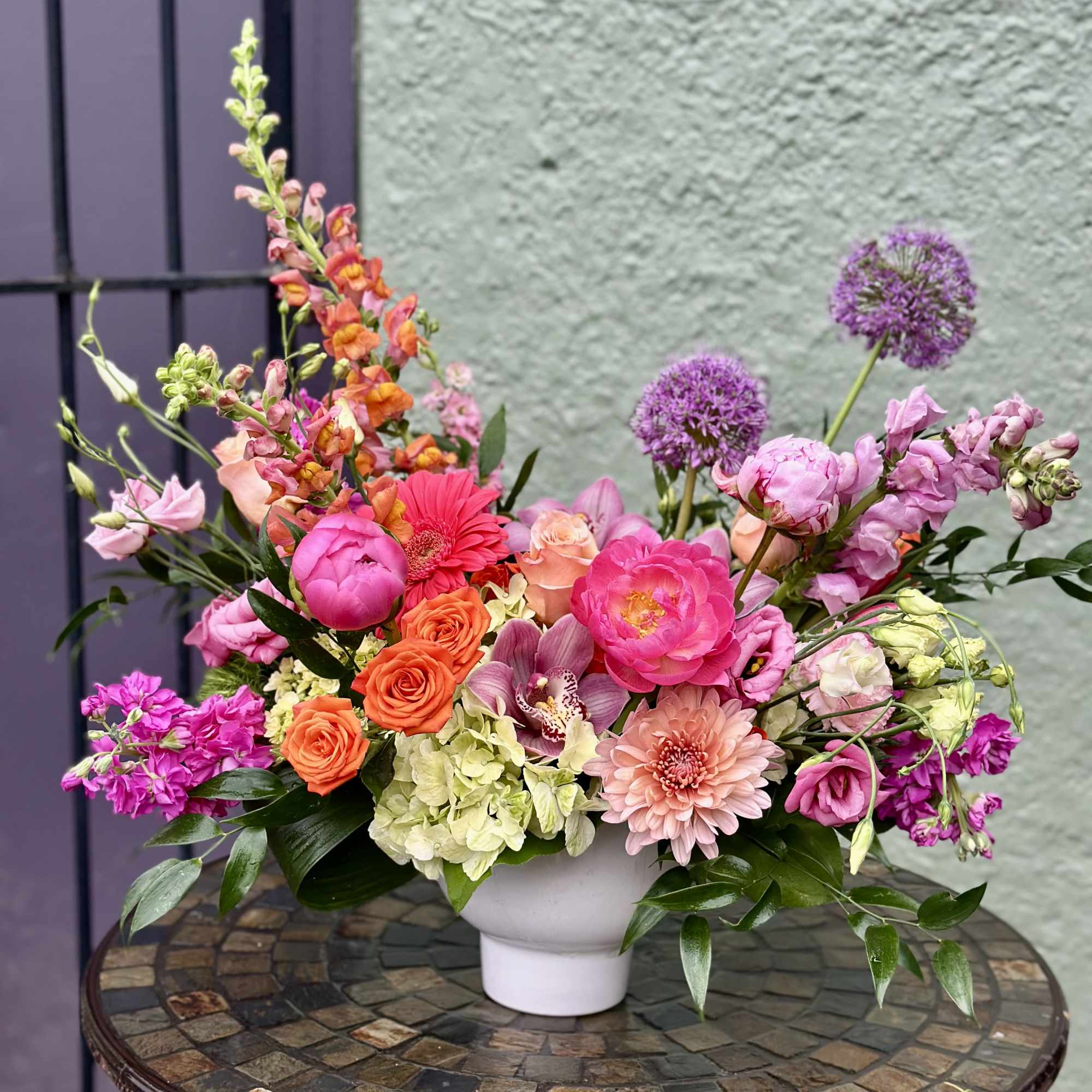 A lush, garden-style centerpiece that feels like a sunlit spring morning-this flower