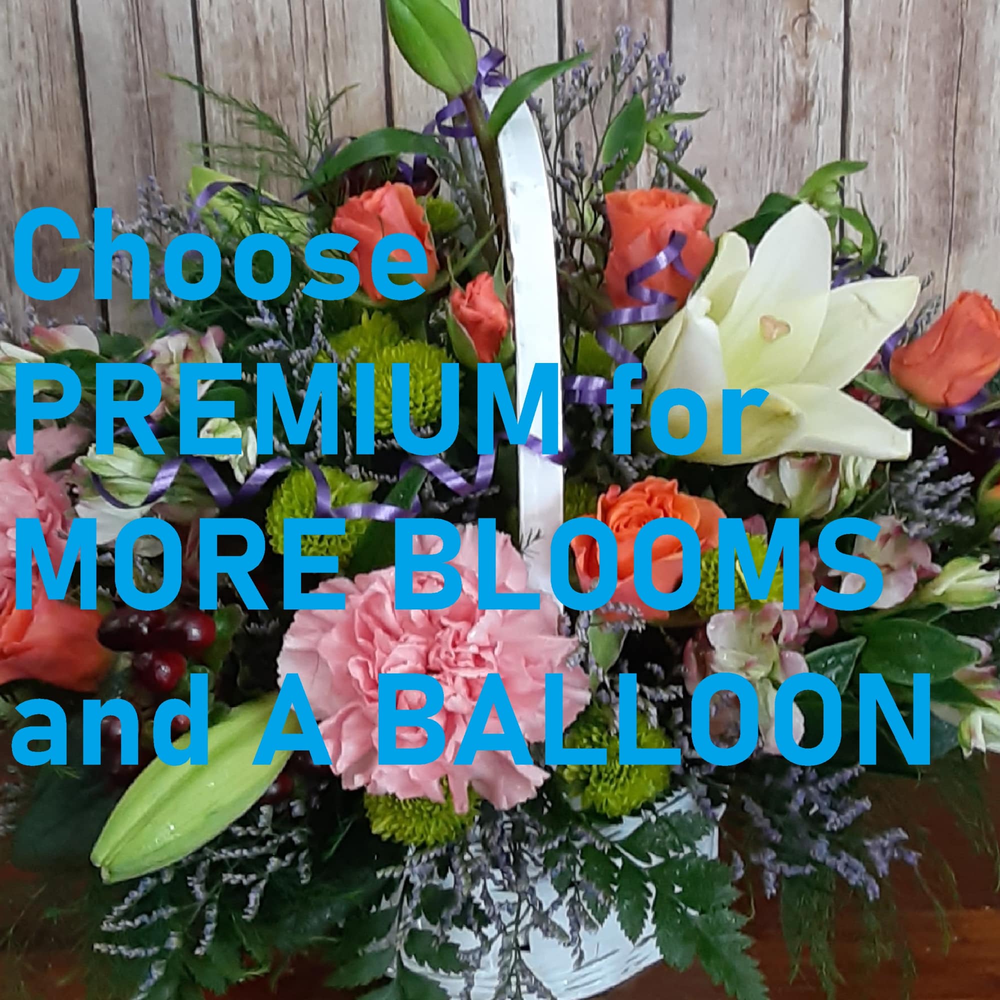 Mixed bouquet in a white basket with roses, lilies, and carnations