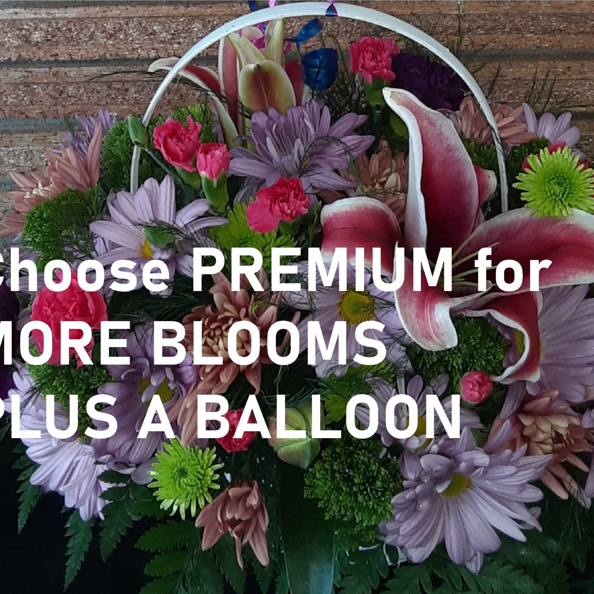 Mixed flower basket with lilies, daisies, and carnations