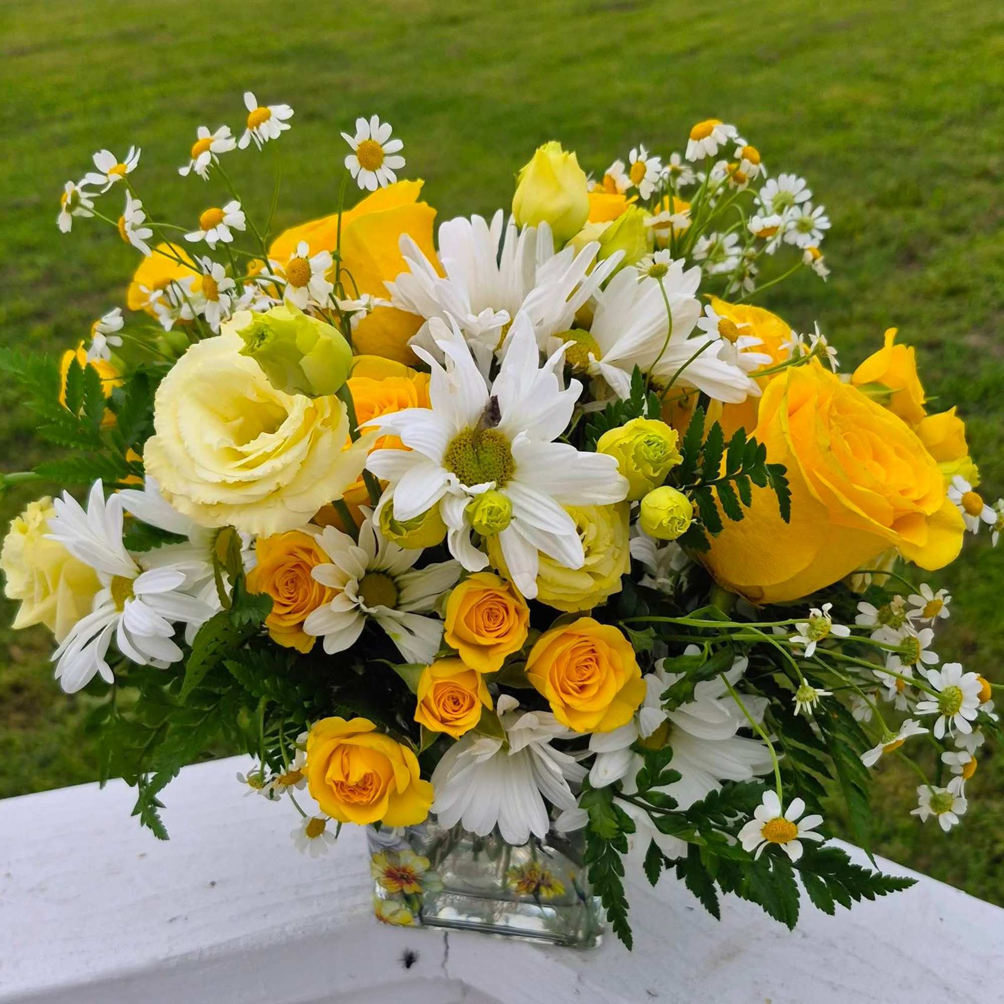 Bring a breath of fresh air indoors with this cheerful, garden-inspired arrangement