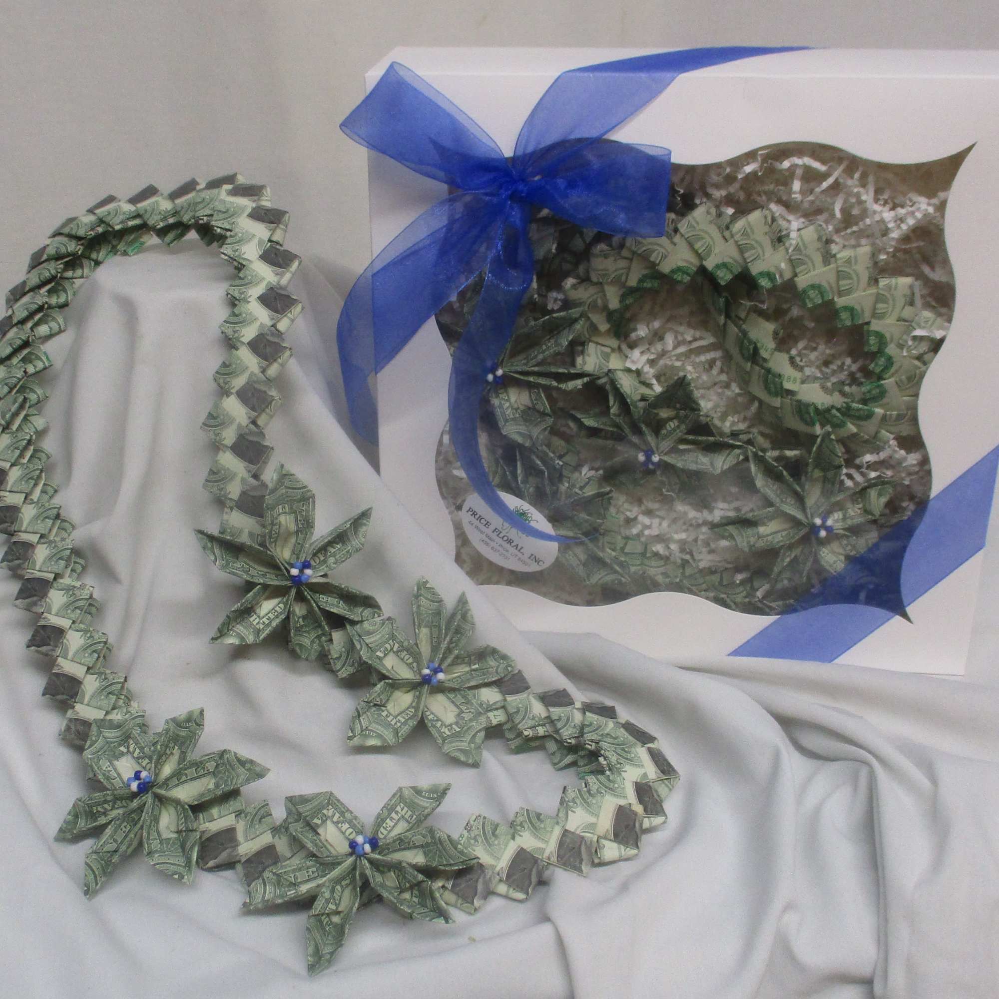 A bold, celebratory twist on a traditional gift-this green-and-white money lei turns