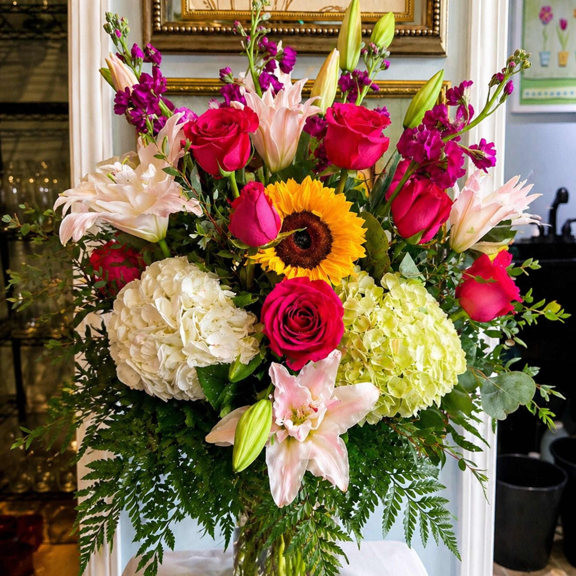 Bright, layered and joyfully colorful, this large mixed flower arrangement-perfect as a