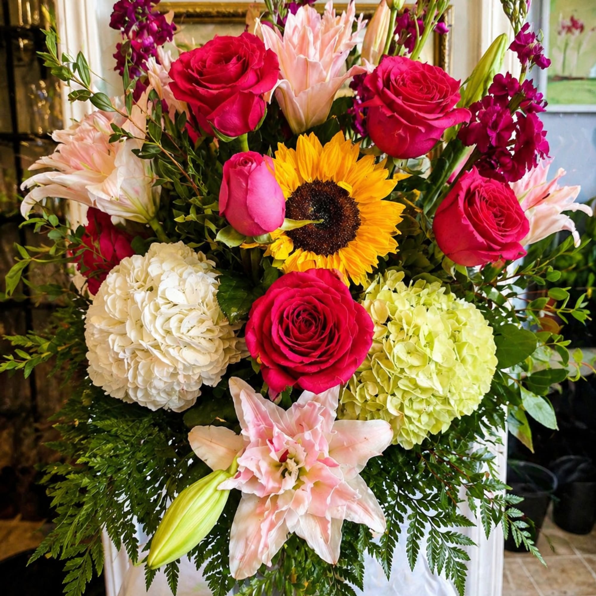 Bright, layered and joyfully colorful, this large mixed flower arrangement-perfect as a
