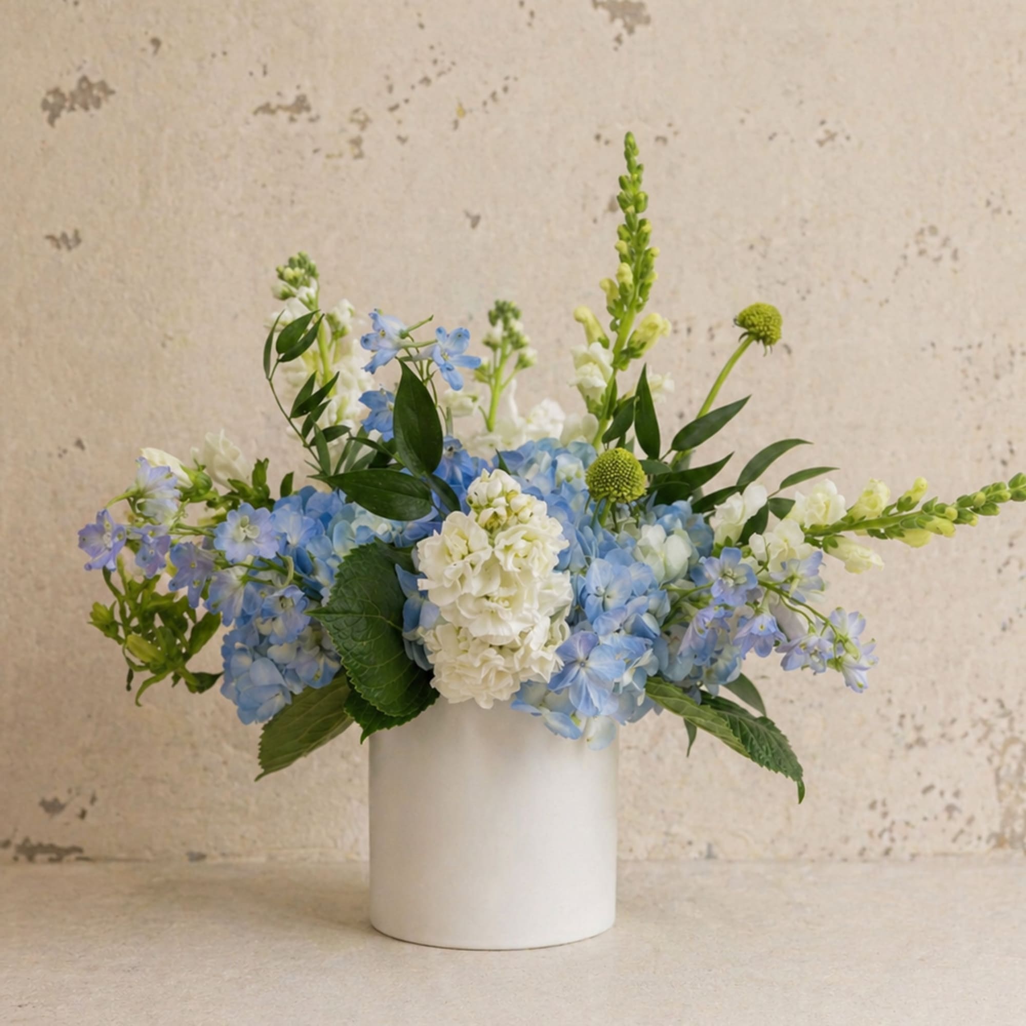 A soft, garden-inspired arrangement designed to feel as special as she is.