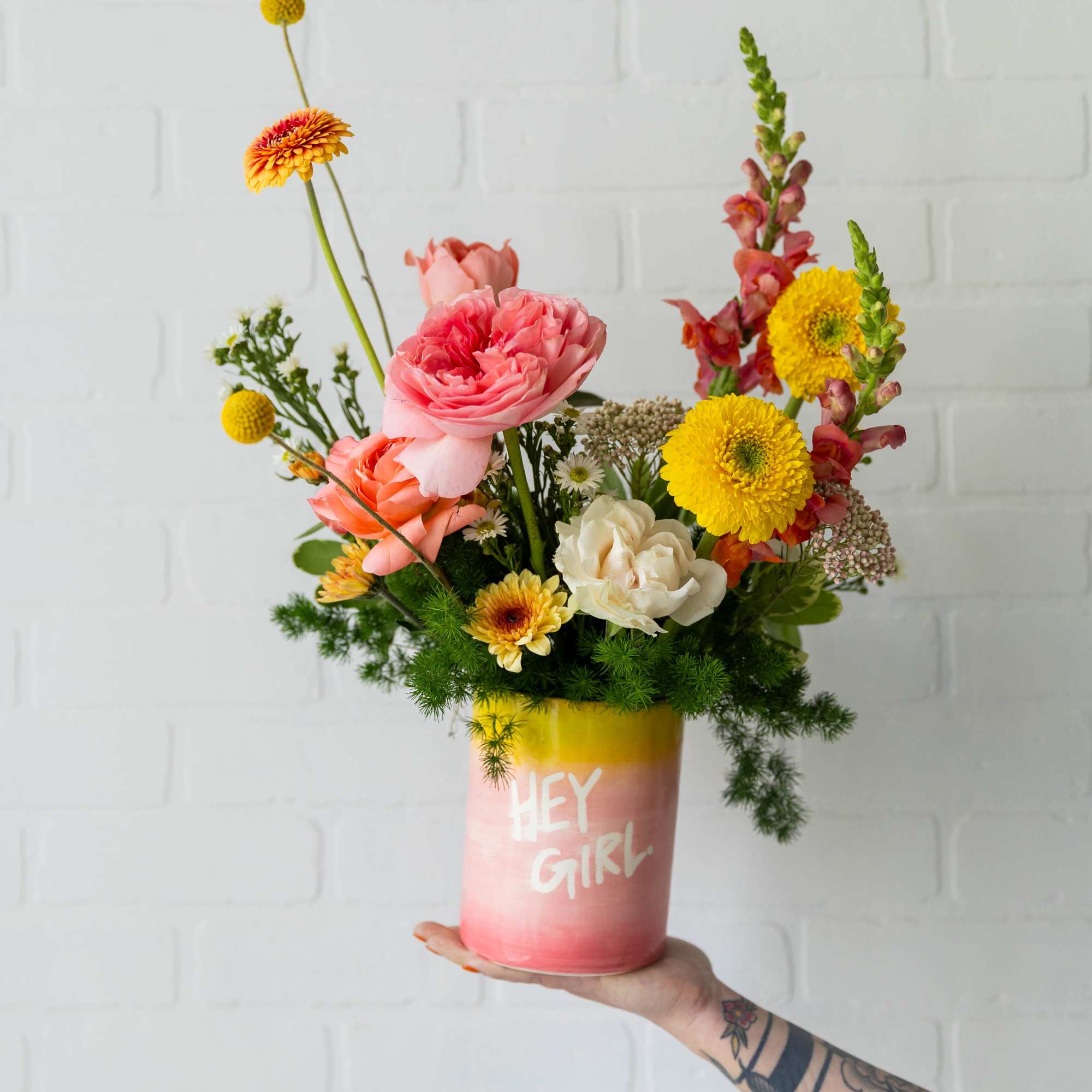 Bright, playful, and full of personality&mdash;just like her. This cheerful arrangement features