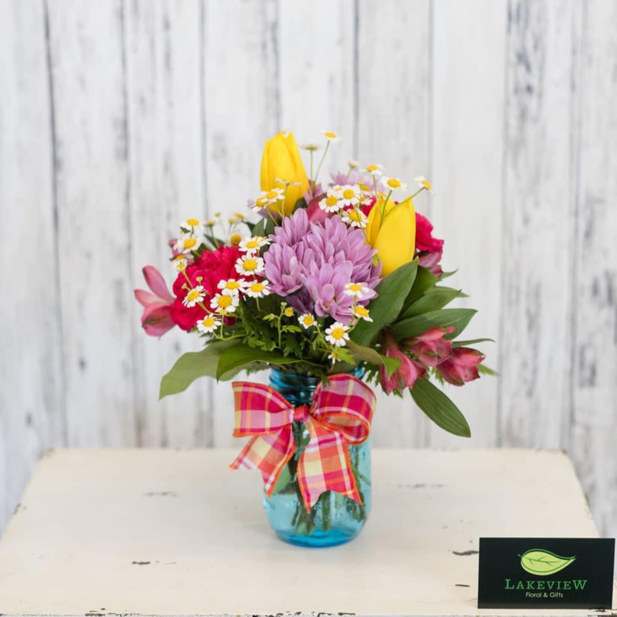 A bright, garden-style flower arrangement designed to make her feel genuinely celebrated-perfect