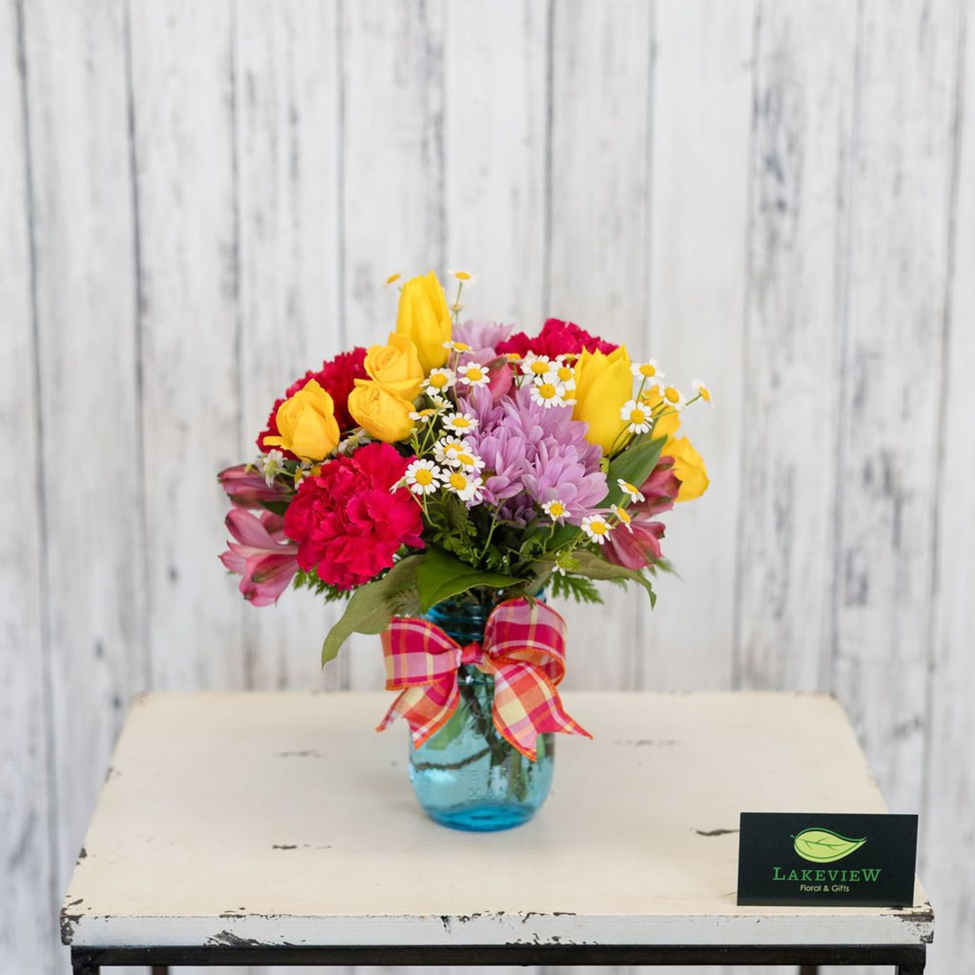 A bright, garden-style flower arrangement designed to make her feel genuinely celebrated-perfect