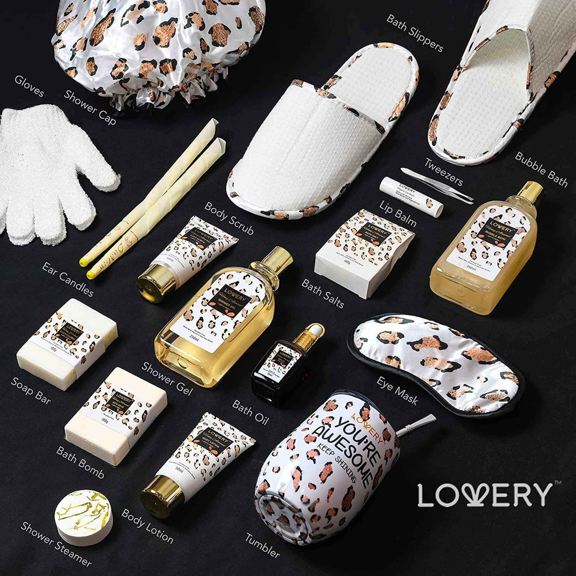 Leopard-print themed spa gift set with bath products, slippers, eye mask, and tumbler on a black background