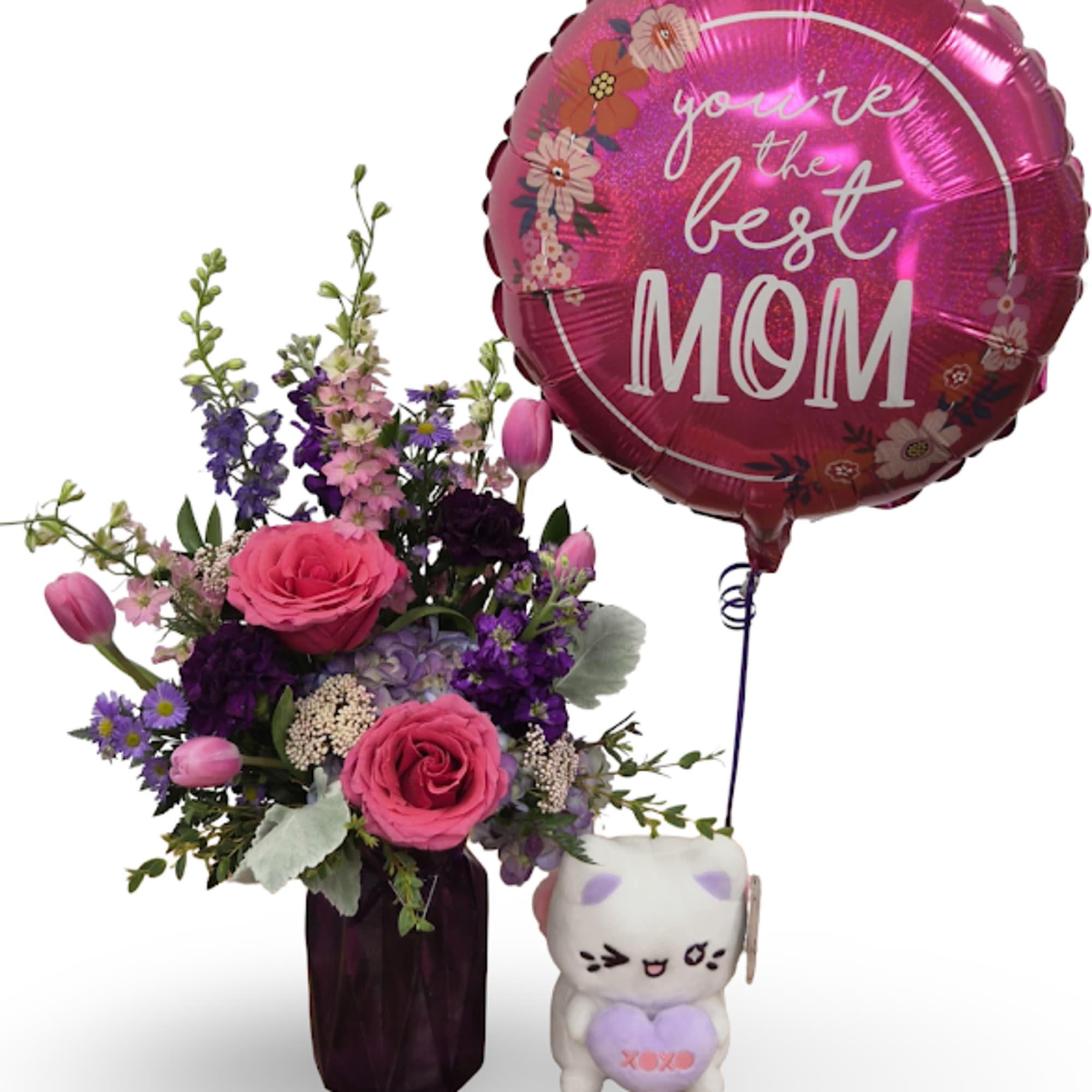 Bursting with saturated pinks and violets, this cheerful flower arrangement is crafted