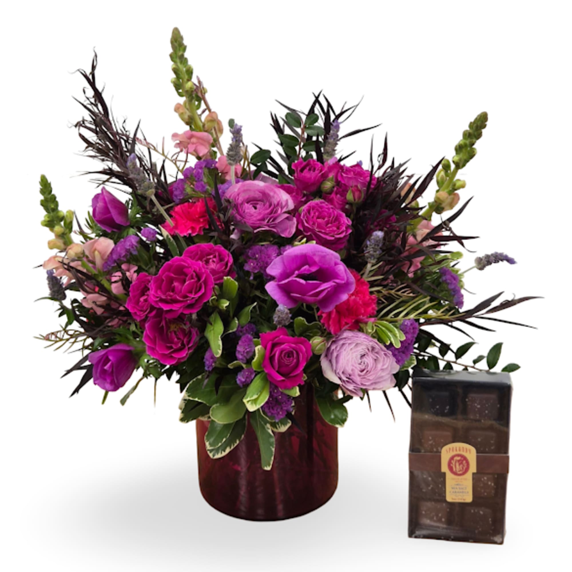 Velvet-rich purples and rosy pinks spill from a deep burgundy vase in